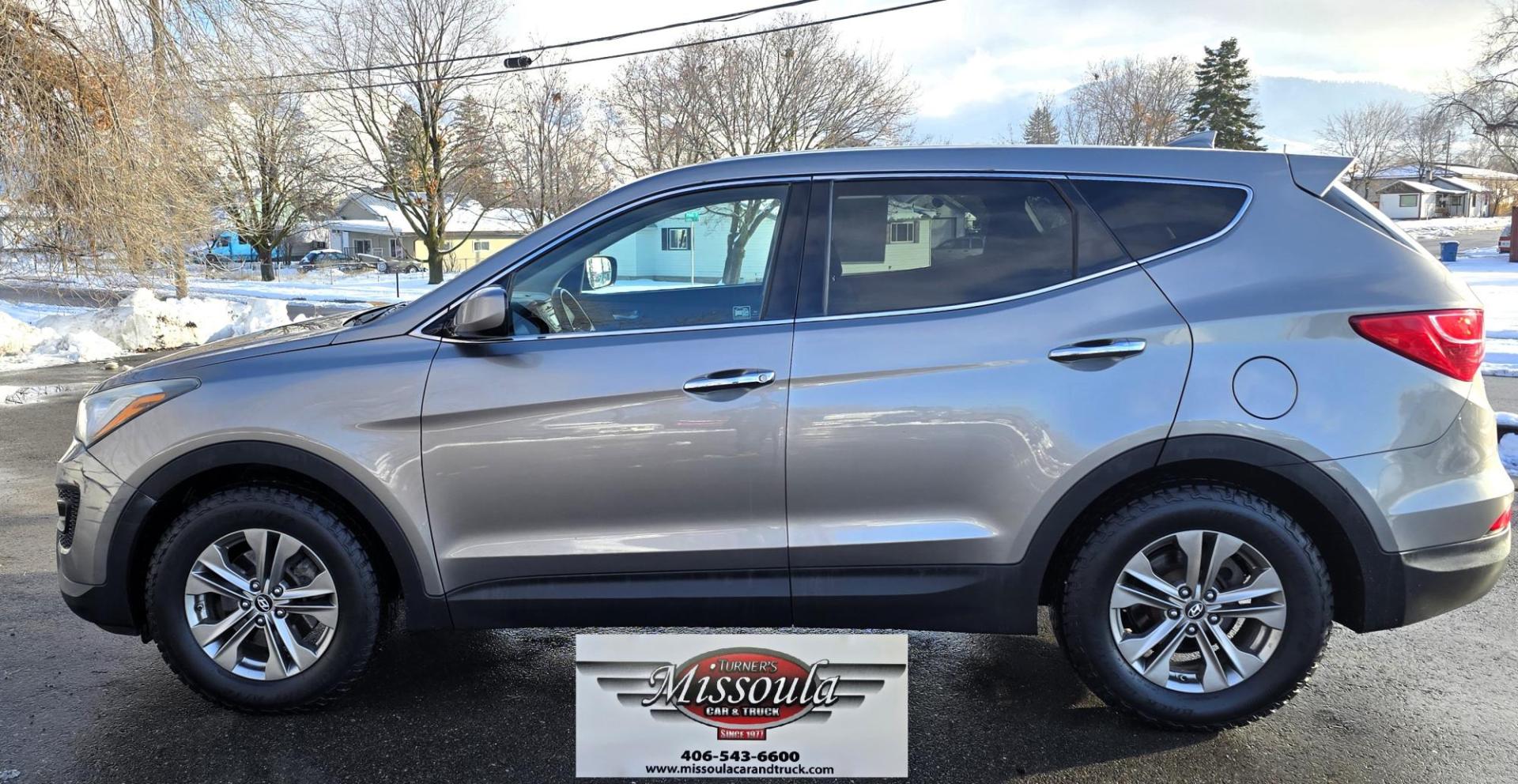 2014 Mineral Gray /Gray Hyundai Santa Fe Sport 2.4 AWD (5XYZTDLB5EG) with an 2.4L L4 DOHC 16V engine, 6-Speed Automatic transmission, located at 450 N Russell, Missoula, MT, 59801, (406) 543-6600, 46.874496, -114.017433 - Great Running FWD SUV Not all wheel drive. 2.4L I4 Engine. Automatic Transmission. Air. Cruise. Tilt. Power Windows and Locks. AM FM CD Player. Bluetooth Audio and Phone. Towing. Has a fair size scratch on the front left fender. - Photo#5