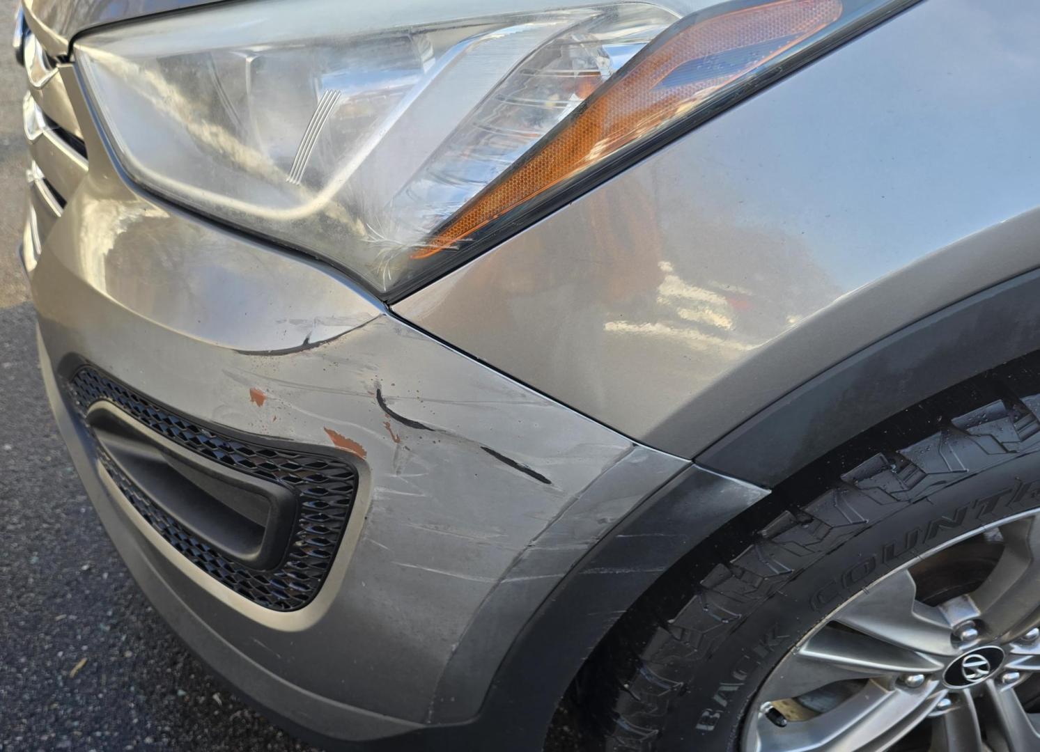 2014 Mineral Gray /Gray Hyundai Santa Fe Sport 2.4 AWD (5XYZTDLB5EG) with an 2.4L L4 DOHC 16V engine, 6-Speed Automatic transmission, located at 450 N Russell, Missoula, MT, 59801, (406) 543-6600, 46.874496, -114.017433 - Great Running FWD SUV Not all wheel drive. 2.4L I4 Engine. Automatic Transmission. Air. Cruise. Tilt. Power Windows and Locks. AM FM CD Player. Bluetooth Audio and Phone. Towing. Has a fair size scratch on the front left fender. - Photo#7