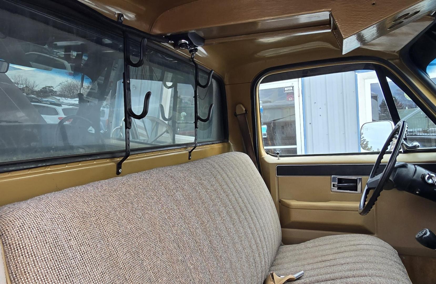 1984 Brown /Tan Chevrolet C/K 10 Custom Deluxe 4WD (1GCEK14H3EJ) with an 5.0L V8 OHV engine, 4 Speed Manual transmission, located at 450 N Russell, Missoula, MT, 59801, (406) 543-6600, 46.874496, -114.017433 - Nice old Square Body 4WD. Brand NEW Tires. Matching Topper. 4 Speed Manual Transmission. 305 V8 Engine. Dual Gas Tanks. Runs amazing. Not perfect but good for it's age. - Photo#11