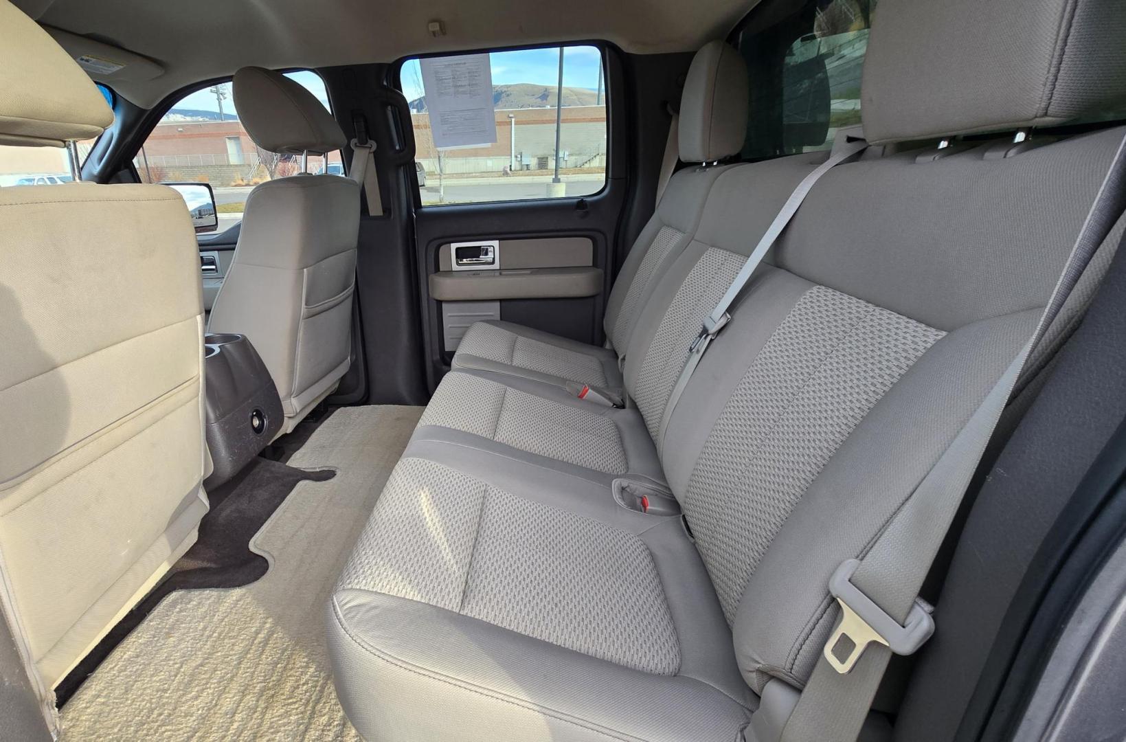 2010 Grey /Gray Ford F-150 XLT SuperCrew 5.5-ft. Bed 4WD (1FTFW1EV4AF) with an 5.4L V8 SOHC 24V FFV engine, 4-Speed Automatic transmission, located at 450 N Russell, Missoula, MT, 59801, (406) 543-6600, 46.874496, -114.017433 - Great Running F150 XLT 4WD. 5.4L V8. 6 Speed Automatic Transmission. 2 Owner with Clean Carfax. Power Drivers Seat. Air. Cruise. Tilt. Adjustable Pedals. Power Windows and Locks. AM FM XM CD. Bluetooth Audio and Phone. Running Boards. Topper and Timber Rack. - Photo#10
