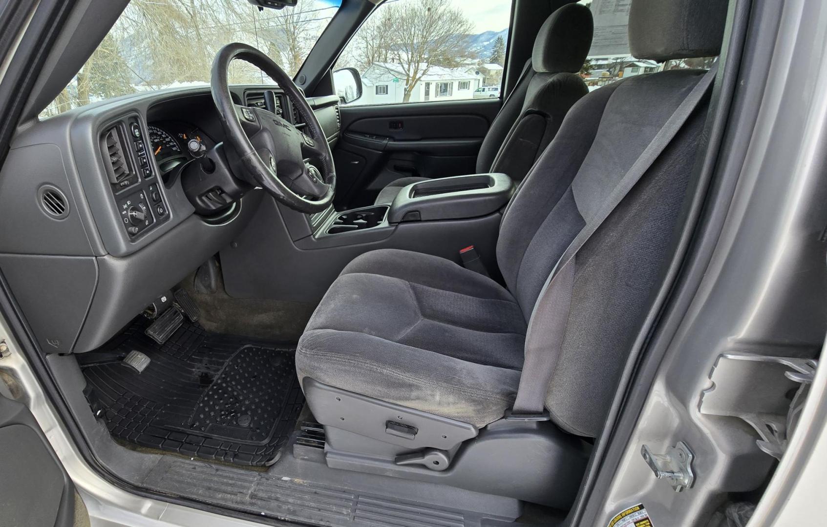 2005 Silver /Gray GMC Sierra 1500 SLE Crew Cab Short Bed 4WD (2GTEK13T151) with an 5.3L V8 OHV 16V engine, 4-Speed Automatic Overdrive transmission, located at 450 N Russell, Missoula, MT, 59801, (406) 543-6600, 46.874496, -114.017433 - Excellent Running 4WD. 5.3L V8 Engine. Automatic Transmission. Air. Cruise. Tilt. Power Drivers Seat. AM FM XM CD. Power Windows and Locks. Very Clean two owner vehicle. Because of the age, our Credit Union does not offer financing on this vehicle. - Photo#9