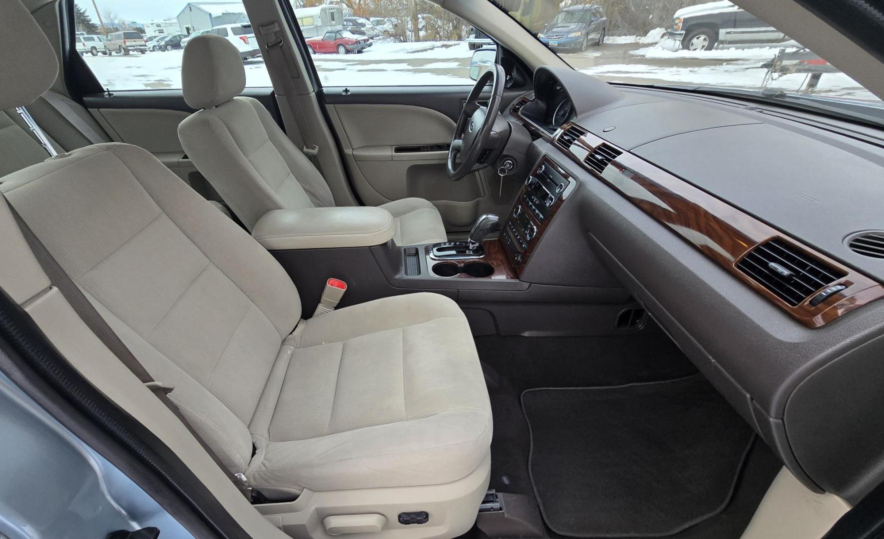 2008 Blue /Tan Ford Taurus SEL AWD (1FAHP27W98G) with an 3.5L V6 DOHC 24V engine, 6-Speed Automatic Overdrive transmission, located at 450 N Russell, Missoula, MT, 59801, (406) 543-6600, 46.874496, -114.017433 - Very Clean 2 Owner AWD Sedan. Only 78K Miles. 3.5L V6 Engine. Power Front Seats. Air. Cruise. Tilt. Power Windows and Locks. AM FM CD Player. - Photo#7