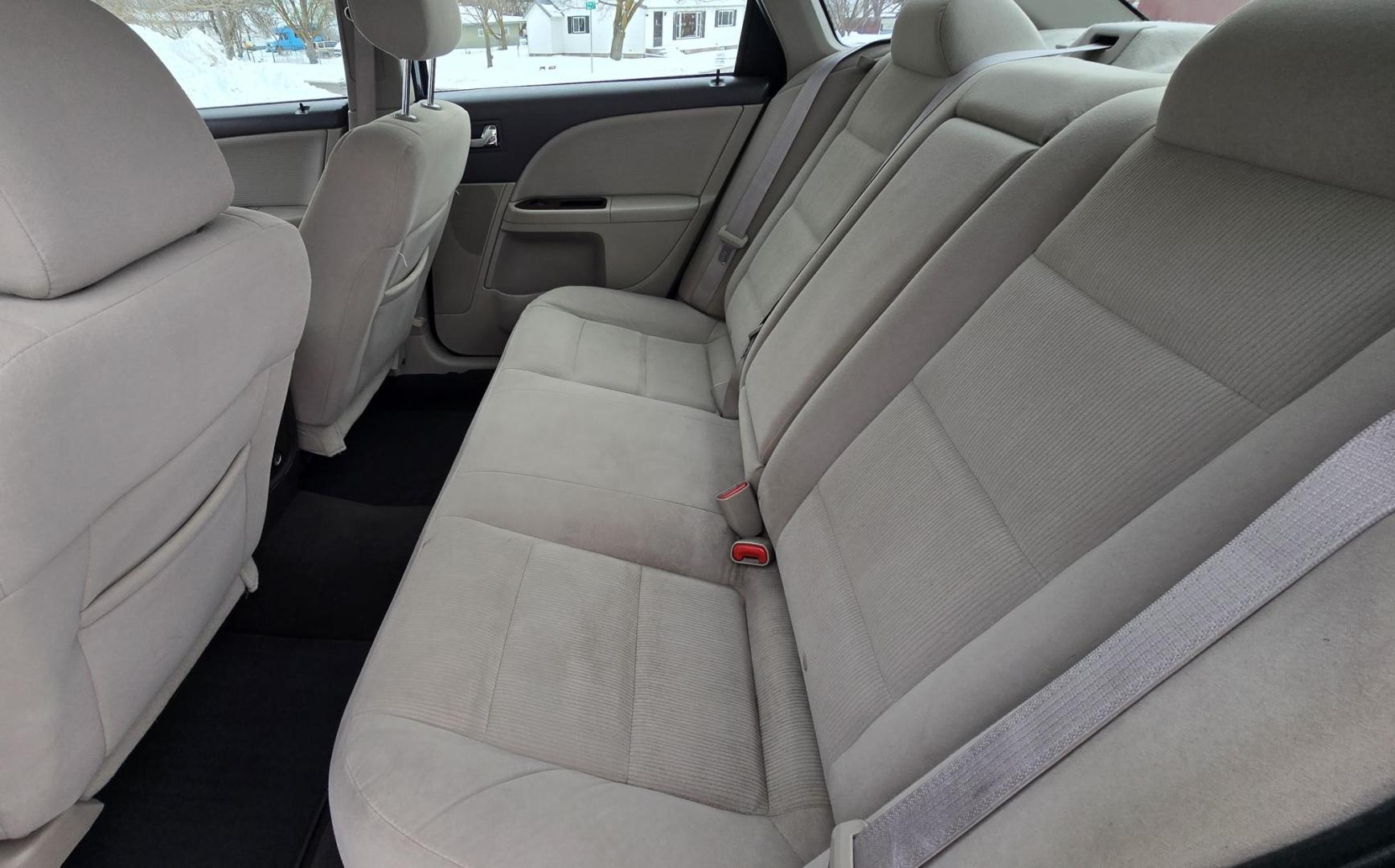 2008 Blue /Tan Ford Taurus SEL AWD (1FAHP27W98G) with an 3.5L V6 DOHC 24V engine, 6-Speed Automatic Overdrive transmission, located at 450 N Russell, Missoula, MT, 59801, (406) 543-6600, 46.874496, -114.017433 - Very Clean 2 Owner AWD Sedan. Only 78K Miles. 3.5L V6 Engine. Power Front Seats. Air. Cruise. Tilt. Power Windows and Locks. AM FM CD Player. - Photo#9