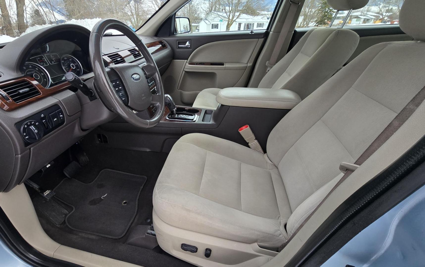 2008 Blue /Tan Ford Taurus SEL AWD (1FAHP27W98G) with an 3.5L V6 DOHC 24V engine, 6-Speed Automatic Overdrive transmission, located at 450 N Russell, Missoula, MT, 59801, (406) 543-6600, 46.874496, -114.017433 - Very Clean 2 Owner AWD Sedan. Only 78K Miles. 3.5L V6 Engine. Power Front Seats. Air. Cruise. Tilt. Power Windows and Locks. AM FM CD Player. - Photo#14