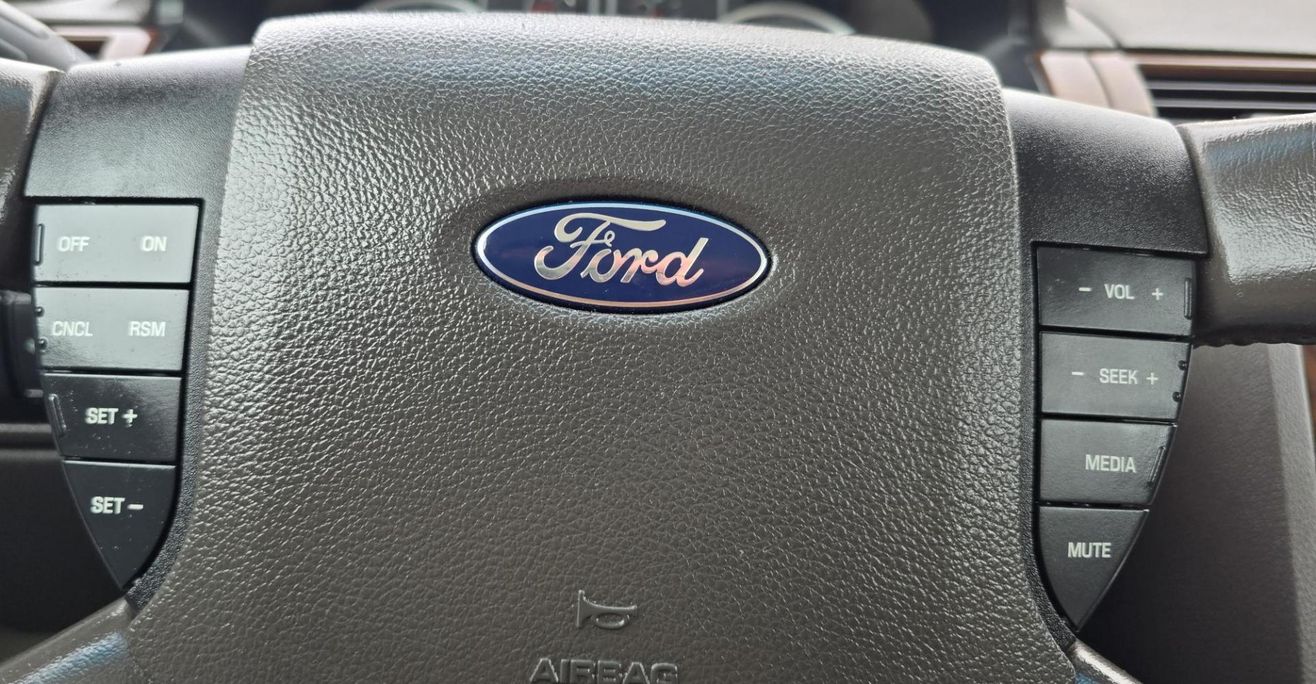2008 Blue /Tan Ford Taurus SEL AWD (1FAHP27W98G) with an 3.5L V6 DOHC 24V engine, 6-Speed Automatic Overdrive transmission, located at 450 N Russell, Missoula, MT, 59801, (406) 543-6600, 46.874496, -114.017433 - Very Clean 2 Owner AWD Sedan. Only 78K Miles. 3.5L V6 Engine. Power Front Seats. Air. Cruise. Tilt. Power Windows and Locks. AM FM CD Player. - Photo#13