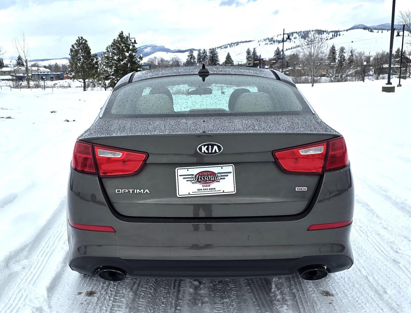 2015 Bronze /Black Kia Optima LX (5XXGM4A70FG) with an 2.4L L4 DOHC 16V engine, 6-Speed Automatic transmission, located at 450 N Russell, Missoula, MT, 59801, (406) 543-6600, 46.874496, -114.017433 - Beautiful Sedan. 2.4L I4 Engine. FWD. Automatic. Air Conditioning, Power Windows and Door Locks, AM/FM/CD/MP3 Audio System, SIRIUSXM®, USB and Auxiliary Input Jacks, Bluetooth® Wireless Technology, Front and Rear Cup Holders, Remote Keyless Entry, Cruise Control, Tilt & Telescopic Steering Column - Photo#7