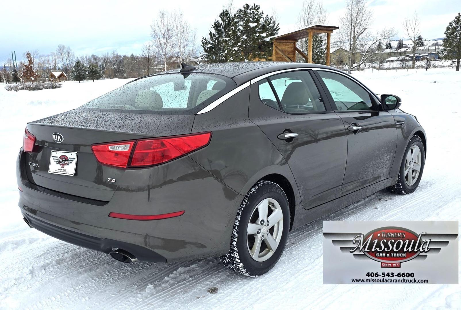 2015 Bronze /Black Kia Optima LX (5XXGM4A70FG) with an 2.4L L4 DOHC 16V engine, 6-Speed Automatic transmission, located at 450 N Russell, Missoula, MT, 59801, (406) 543-6600, 46.874496, -114.017433 - Beautiful Sedan. 2.4L I4 Engine. FWD. Automatic. Air Conditioning, Power Windows and Door Locks, AM/FM/CD/MP3 Audio System, SIRIUSXM®, USB and Auxiliary Input Jacks, Bluetooth® Wireless Technology, Front and Rear Cup Holders, Remote Keyless Entry, Cruise Control, Tilt & Telescopic Steering Column - Photo#1