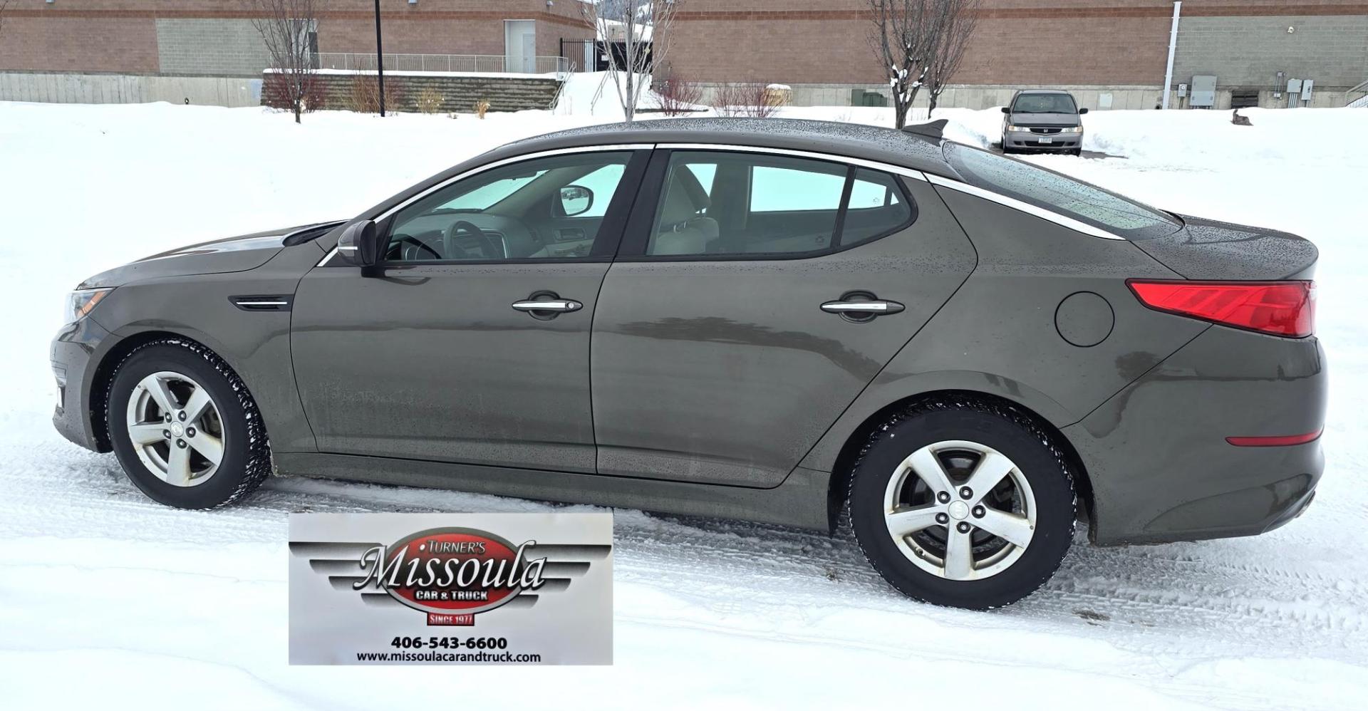 2015 Bronze /Black Kia Optima LX (5XXGM4A70FG) with an 2.4L L4 DOHC 16V engine, 6-Speed Automatic transmission, located at 450 N Russell, Missoula, MT, 59801, (406) 543-6600, 46.874496, -114.017433 - Beautiful Sedan. 2.4L I4 Engine. FWD. Automatic. Air Conditioning, Power Windows and Door Locks, AM/FM/CD/MP3 Audio System, SIRIUSXM®, USB and Auxiliary Input Jacks, Bluetooth® Wireless Technology, Front and Rear Cup Holders, Remote Keyless Entry, Cruise Control, Tilt & Telescopic Steering Column - Photo#3