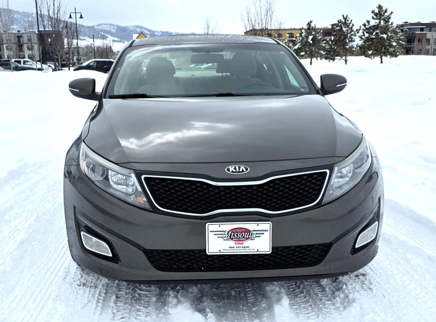 2015 Bronze /Black Kia Optima LX (5XXGM4A70FG) with an 2.4L L4 DOHC 16V engine, 6-Speed Automatic transmission, located at 450 N Russell, Missoula, MT, 59801, (406) 543-6600, 46.874496, -114.017433 - Beautiful Sedan. 2.4L I4 Engine. FWD. Automatic. Air Conditioning, Power Windows and Door Locks, AM/FM/CD/MP3 Audio System, SIRIUSXM®, USB and Auxiliary Input Jacks, Bluetooth® Wireless Technology, Front and Rear Cup Holders, Remote Keyless Entry, Cruise Control, Tilt & Telescopic Steering Column - Photo#4