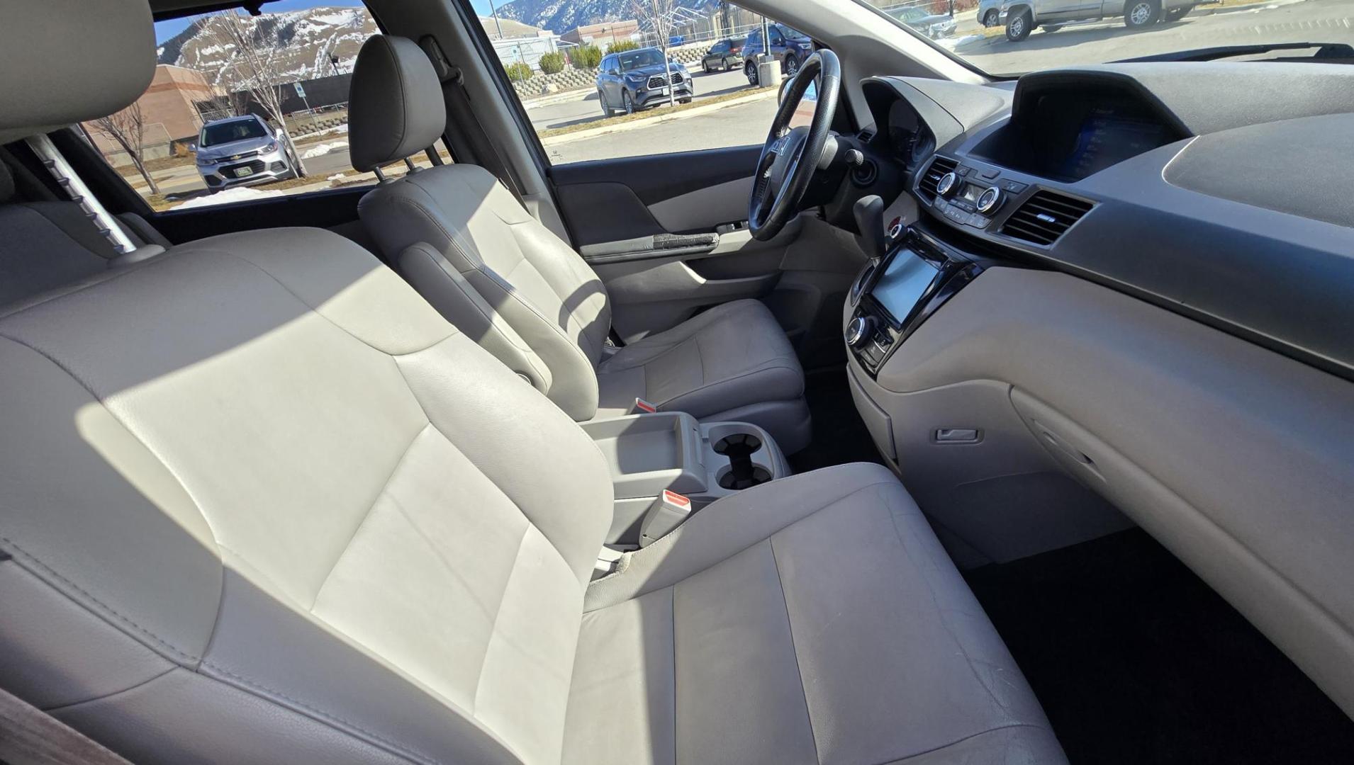 2014 Blue /Tan Honda Odyssey EX-L (5FNRL5H69EB) with an 3.5L V6 SOHC 24V engine, 6-Speed Automatic transmission, located at 450 N Russell, Missoula, MT, 59801, (406) 543-6600, 46.874496, -114.017433 - 3.5L V6 Engine. Automatic Transmission. 3rd Row Seating. Air. Cruise. Tilt. Power Sunroof. Heated Seats. Power Front Seats. Air. Cruise. Tilt. Power Sliding Doors. Backup Camera. - Photo#13