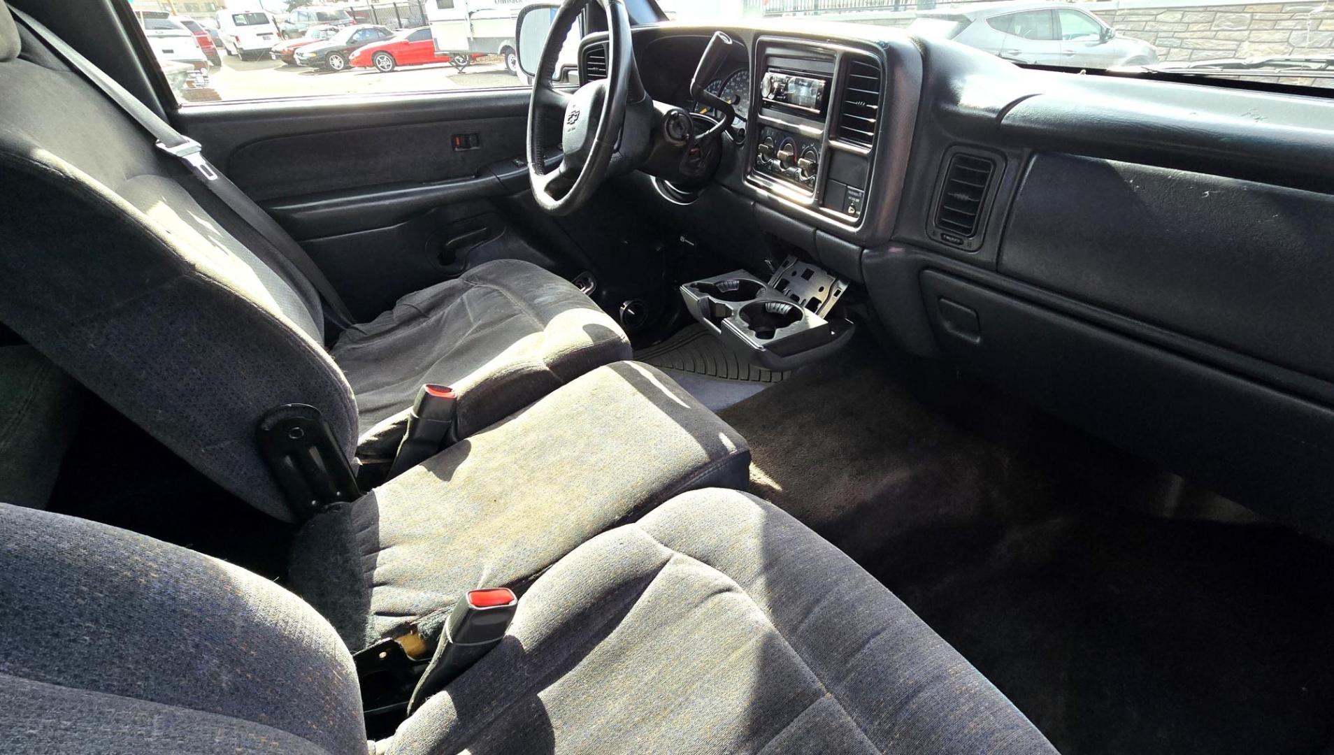 1999 Black /Black Chevrolet Silverado 1500 Ext. Cab Long Bed 4WD (2GCEK19T7X1) with an 5.3L V8 OHV 16V engine, located at 450 N Russell, Missoula, MT, 59801, (406) 543-6600, 46.874496, -114.017433 - Beautiful Chevy 4WD. 5.3L V8 Engine. Automatic Transmission. Previous Owner had it repainted a few years ago. It's not perfect but still really nice. Runs Amazing. Has Two Deep Cycle Marine Batteries and Two Alternators.. Air. Cruise. Tilt. Power Windows and Locks. Aftermarket Wheels and Pirelli Sco - Photo#14