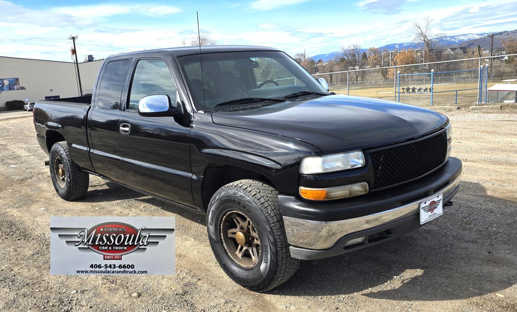 1999 Black /Black Chevrolet Silverado 1500 Ext. Cab Long Bed 4WD (2GCEK19T7X1) with an 5.3L V8 OHV 16V engine, located at 450 N Russell, Missoula, MT, 59801, (406) 543-6600, 46.874496, -114.017433 - Beautiful Chevy 4WD. 5.3L V8 Engine. Automatic Transmission. Previous Owner had it repainted a few years ago. It's not perfect but still really nice. Runs Amazing. Has Two Deep Cycle Marine Batteries and Two Alternators.. Air. Cruise. Tilt. Power Windows and Locks. Aftermarket Wheels and Pirelli Sco - Photo#2