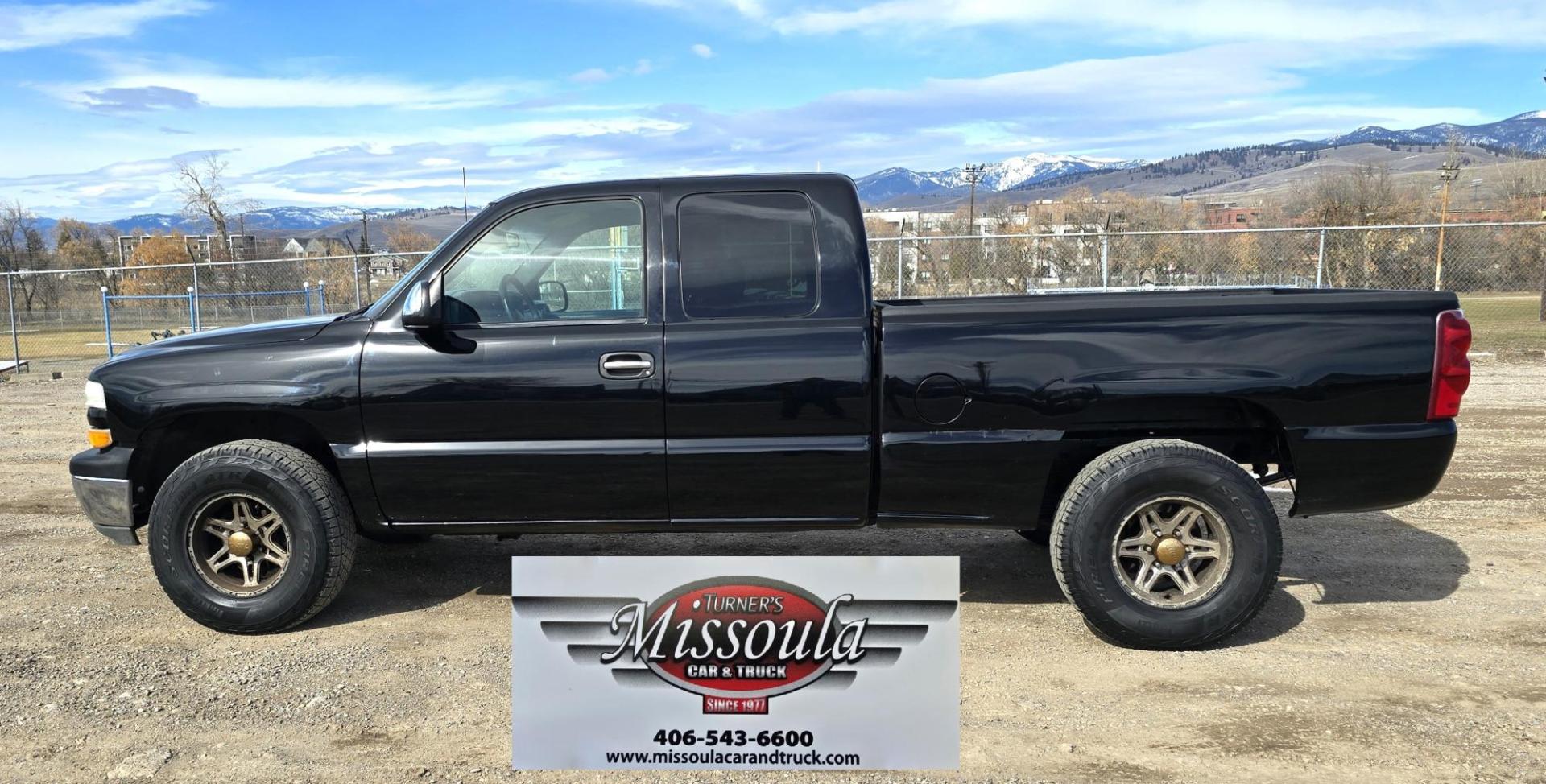 1999 Black /Black Chevrolet Silverado 1500 Ext. Cab Long Bed 4WD (2GCEK19T7X1) with an 5.3L V8 OHV 16V engine, located at 450 N Russell, Missoula, MT, 59801, (406) 543-6600, 46.874496, -114.017433 - Beautiful Chevy 4WD. 5.3L V8 Engine. Automatic Transmission. Previous Owner had it repainted a few years ago. It's not perfect but still really nice. Runs Amazing. Has Two Deep Cycle Marine Batteries and Two Alternators.. Air. Cruise. Tilt. Power Windows and Locks. Aftermarket Wheels and Pirelli Sco - Photo#1