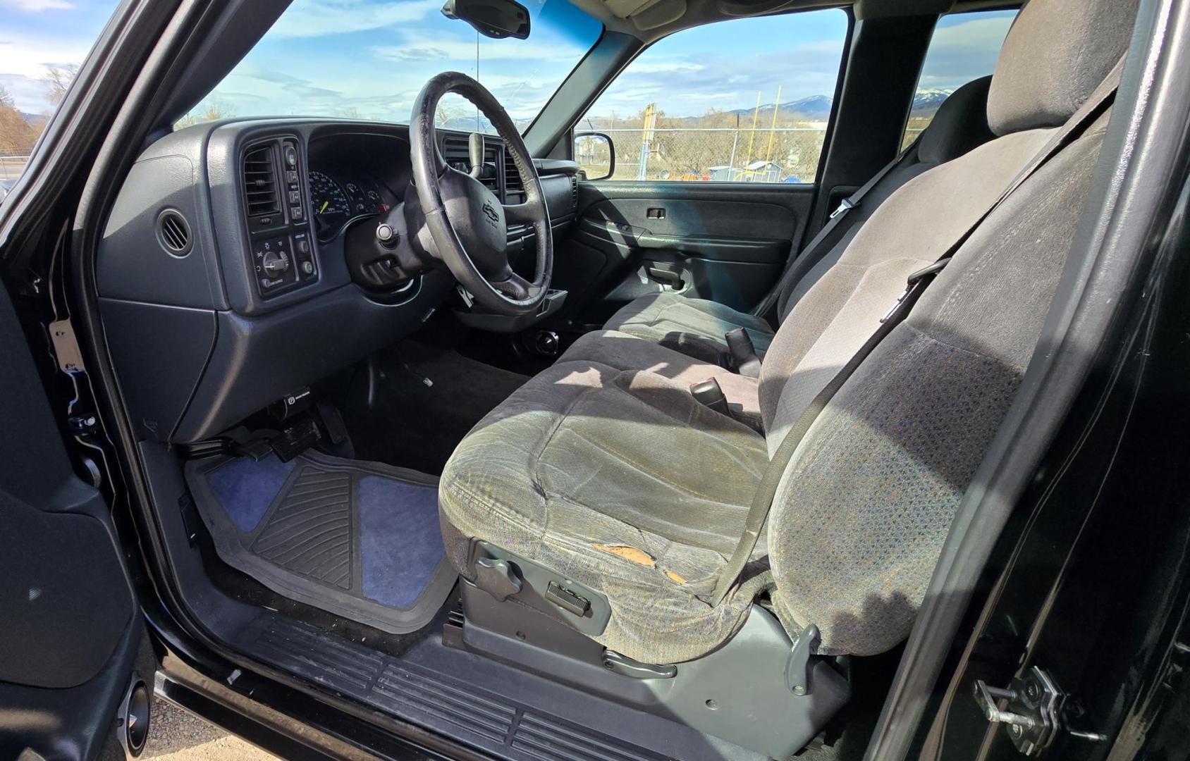 1999 Black /Black Chevrolet Silverado 1500 Ext. Cab Long Bed 4WD (2GCEK19T7X1) with an 5.3L V8 OHV 16V engine, located at 450 N Russell, Missoula, MT, 59801, (406) 543-6600, 46.874496, -114.017433 - Beautiful Chevy 4WD. 5.3L V8 Engine. Automatic Transmission. Previous Owner had it repainted a few years ago. It's not perfect but still really nice. Runs Amazing. Has Two Deep Cycle Marine Batteries and Two Alternators.. Air. Cruise. Tilt. Power Windows and Locks. Aftermarket Wheels and Pirelli Sco - Photo#8