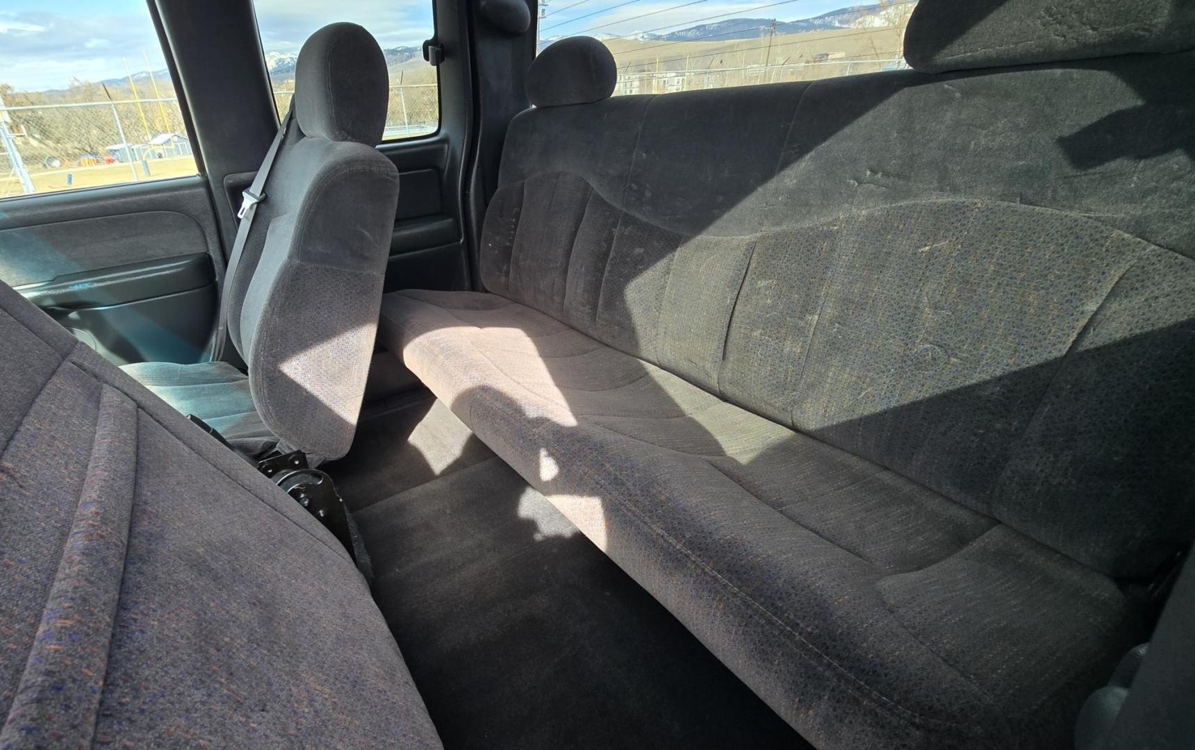 1999 Black /Black Chevrolet Silverado 1500 Ext. Cab Long Bed 4WD (2GCEK19T7X1) with an 5.3L V8 OHV 16V engine, located at 450 N Russell, Missoula, MT, 59801, (406) 543-6600, 46.874496, -114.017433 - Beautiful Chevy 4WD. 5.3L V8 Engine. Automatic Transmission. Previous Owner had it repainted a few years ago. It's not perfect but still really nice. Runs Amazing. Has Two Deep Cycle Marine Batteries and Two Alternators.. Air. Cruise. Tilt. Power Windows and Locks. Aftermarket Wheels and Pirelli Sco - Photo#9