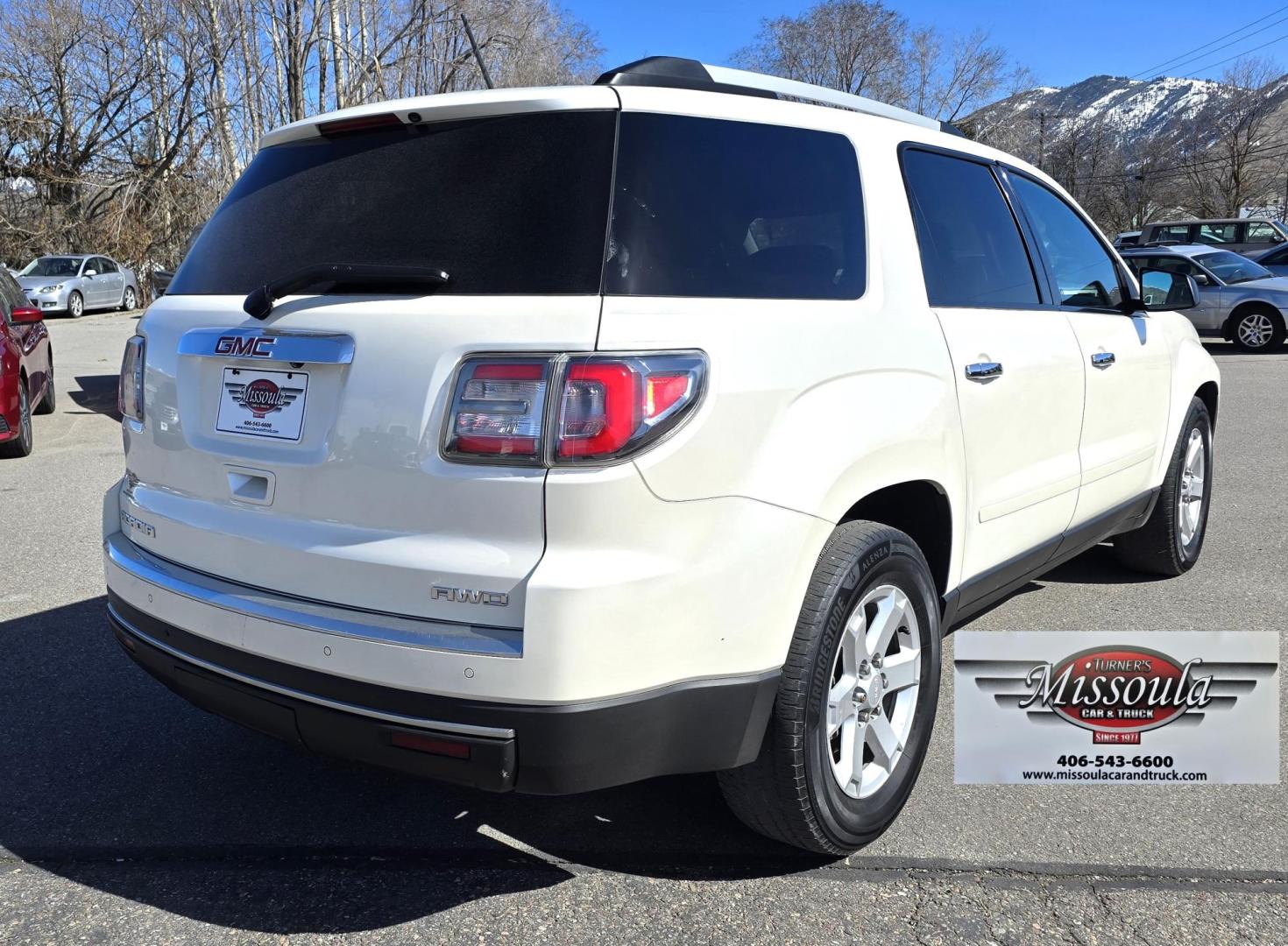 2013 White /Black GMC Acadia SLE-2 AWD (1GKKVPED2DJ) with an 3.6L V6 DOHC 24V engine, 6A transmission, located at 450 N Russell, Missoula, MT, 59801, (406) 543-6600, 46.874496, -114.017433 - Sharp AWD SUV. 3rd Row Seating. 3.6L V6. Automatic. Air. Cruise. Tilt. 2nd Row Captains Seats. Heated Front Seats. Power Lift Gate. Bluetooth Audio and Phone. Remote Start. Towing. - Photo#4
