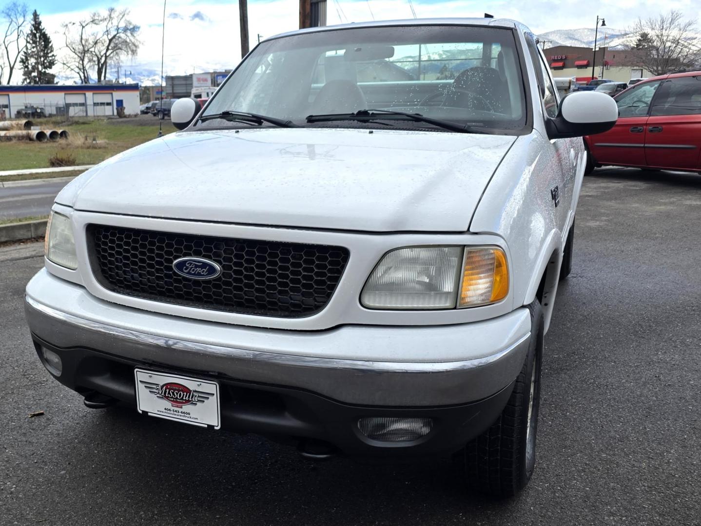 2003 White /Black Ford F-150 XL 4WD (2FTRF18L73C) with an 5.4L V8 SOHC 16V engine, Automatic transmission, located at 450 N Russell, Missoula, MT, 59801, (406) 543-6600, 46.874496, -114.017433 - Single Cab Long Box. 5.4L V8. Automatic Transmission. 4WD. Lot's of miles but runs great. Power Drivers Seat. Air. Cruise. Power Windows and Locks. Aftermarket Bluetooth. Nice tool box. New Tires. Because of the age, financing through our lenders is not available. - Photo#4