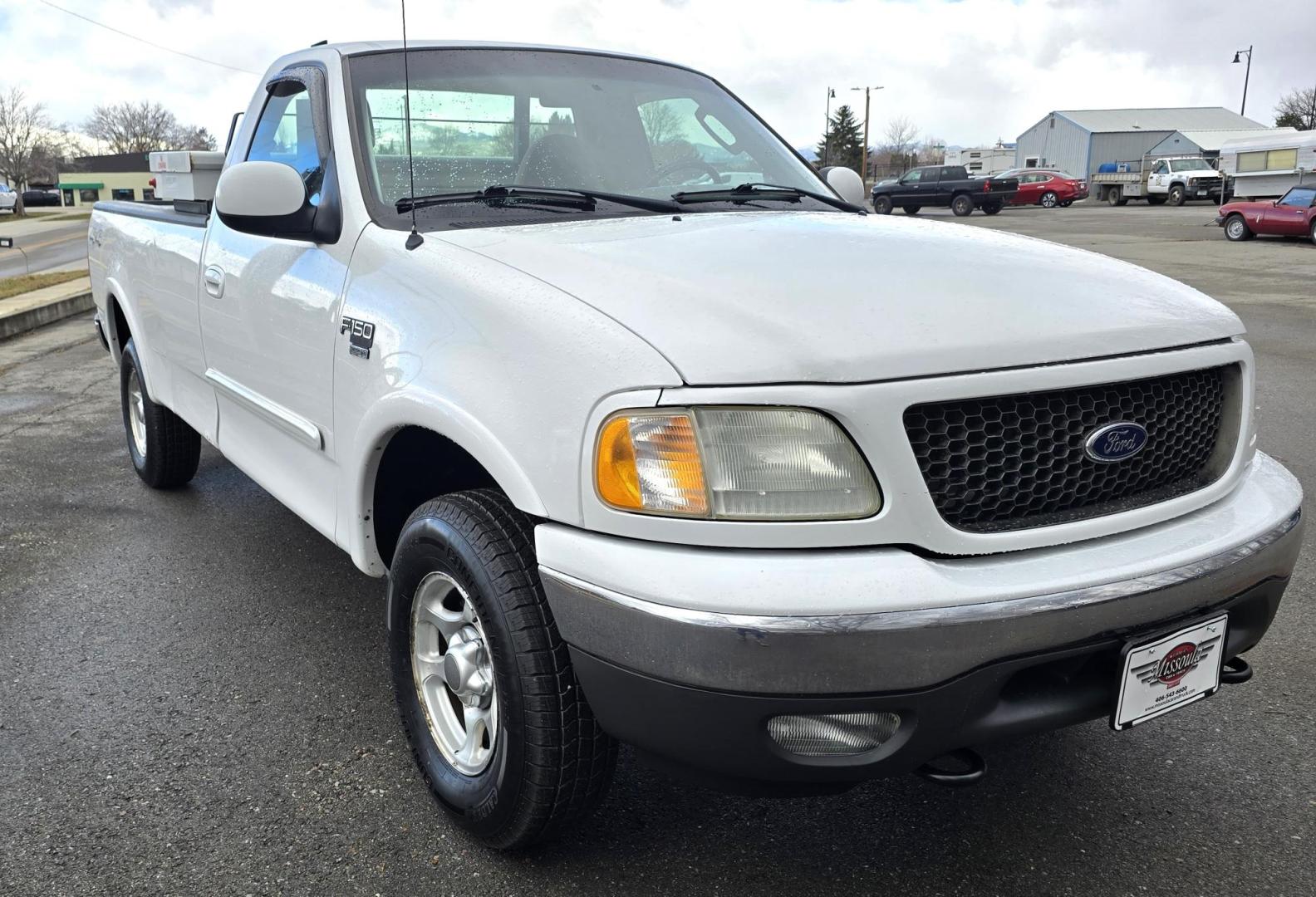 2003 White /Black Ford F-150 XL 4WD (2FTRF18L73C) with an 5.4L V8 SOHC 16V engine, Automatic transmission, located at 450 N Russell, Missoula, MT, 59801, (406) 543-6600, 46.874496, -114.017433 - Single Cab Long Box. 5.4L V8. Automatic Transmission. 4WD. Lot's of miles but runs great. Power Drivers Seat. Air. Cruise. Power Windows and Locks. Aftermarket Bluetooth. Nice tool box. New Tires. Because of the age, financing through our lenders is not available. - Photo#5