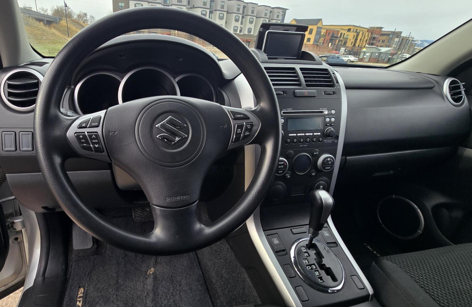2012 Silver /Black Suzuki Grand Vitara Premium 4WD (JS3TD0D6XC4) with an 2.4L L4 DOHC 16V engine, 4-Speed Automatic transmission, located at 450 N Russell, Missoula, MT, 59801, (406) 543-6600, 46.874496, -114.017433 - Clean Little One Owner AWD SUV. 2.4L I4 Engine. Automatic Transmission. Air Cruise Tilt. Power Windows and Locks. Like New BF Goodrich Tires. - Photo#11