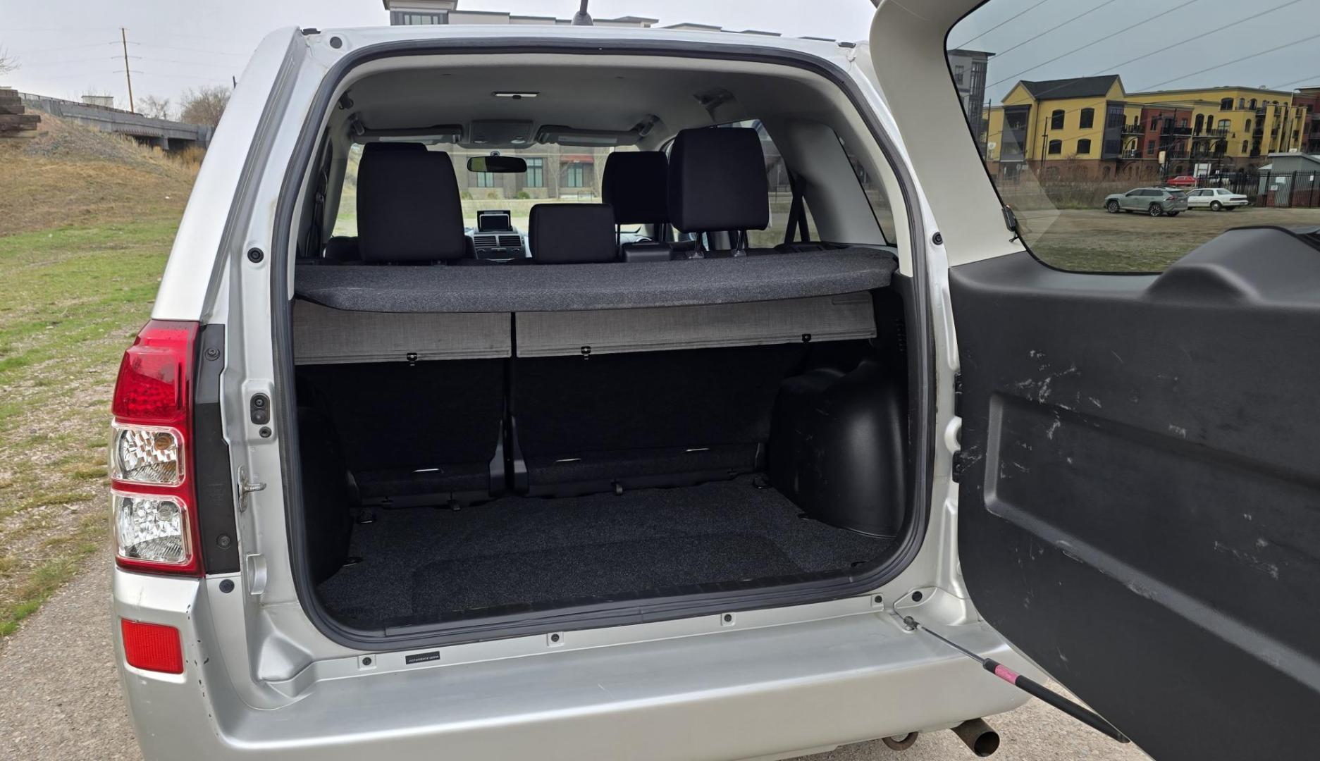 2012 Silver /Black Suzuki Grand Vitara Premium 4WD (JS3TD0D6XC4) with an 2.4L L4 DOHC 16V engine, 4-Speed Automatic transmission, located at 450 N Russell, Missoula, MT, 59801, (406) 543-6600, 46.874496, -114.017433 - Clean Little One Owner AWD SUV. 2.4L I4 Engine. Automatic Transmission. Air Cruise Tilt. Power Windows and Locks. Like New BF Goodrich Tires. - Photo#6