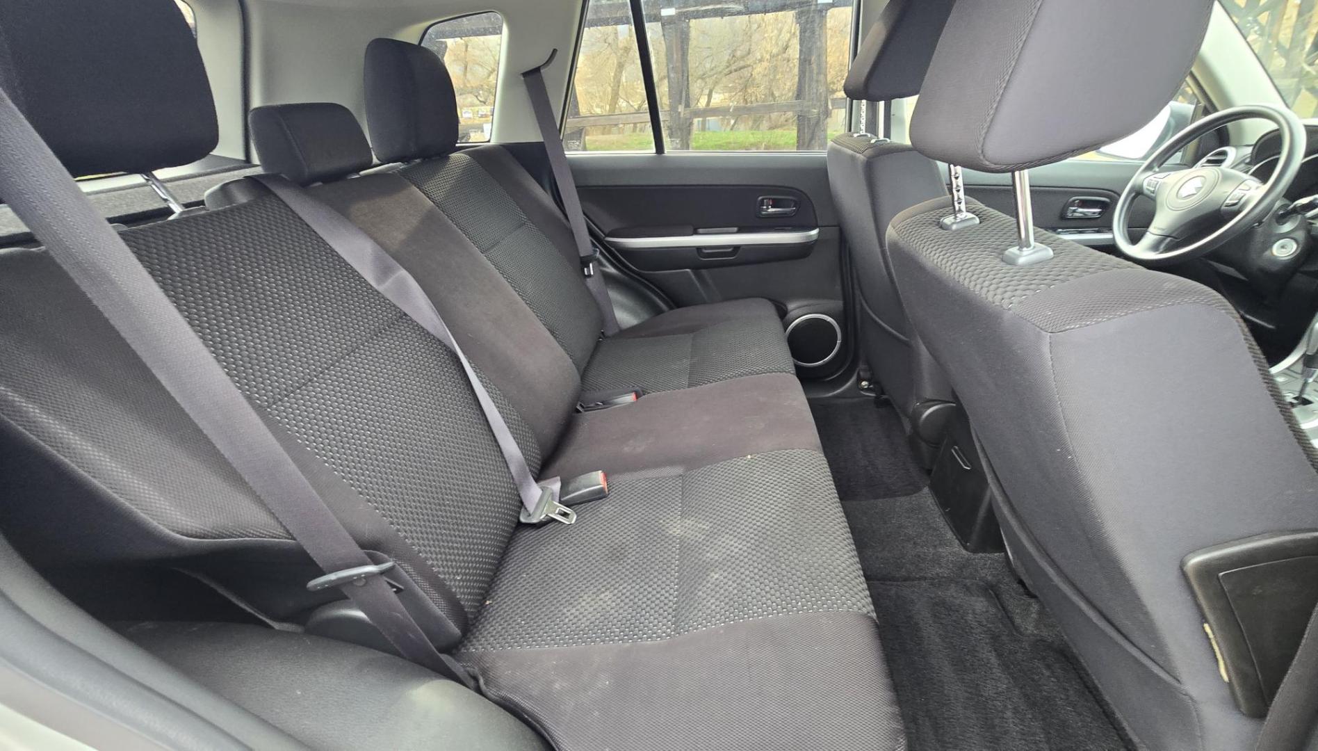 2012 Silver /Black Suzuki Grand Vitara Premium 4WD (JS3TD0D6XC4) with an 2.4L L4 DOHC 16V engine, 4-Speed Automatic transmission, located at 450 N Russell, Missoula, MT, 59801, (406) 543-6600, 46.874496, -114.017433 - Clean Little One Owner AWD SUV. 2.4L I4 Engine. Automatic Transmission. Air Cruise Tilt. Power Windows and Locks. Like New BF Goodrich Tires. - Photo#8
