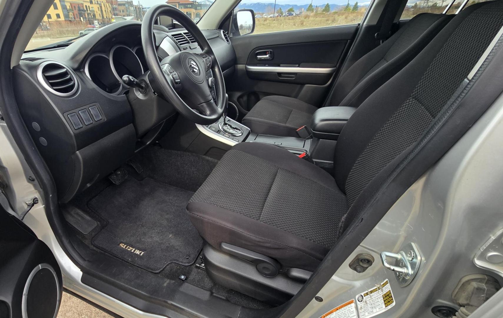 2012 Silver /Black Suzuki Grand Vitara Premium 4WD (JS3TD0D6XC4) with an 2.4L L4 DOHC 16V engine, 4-Speed Automatic transmission, located at 450 N Russell, Missoula, MT, 59801, (406) 543-6600, 46.874496, -114.017433 - Clean Little One Owner AWD SUV. 2.4L I4 Engine. Automatic Transmission. Air Cruise Tilt. Power Windows and Locks. Like New BF Goodrich Tires. - Photo#9