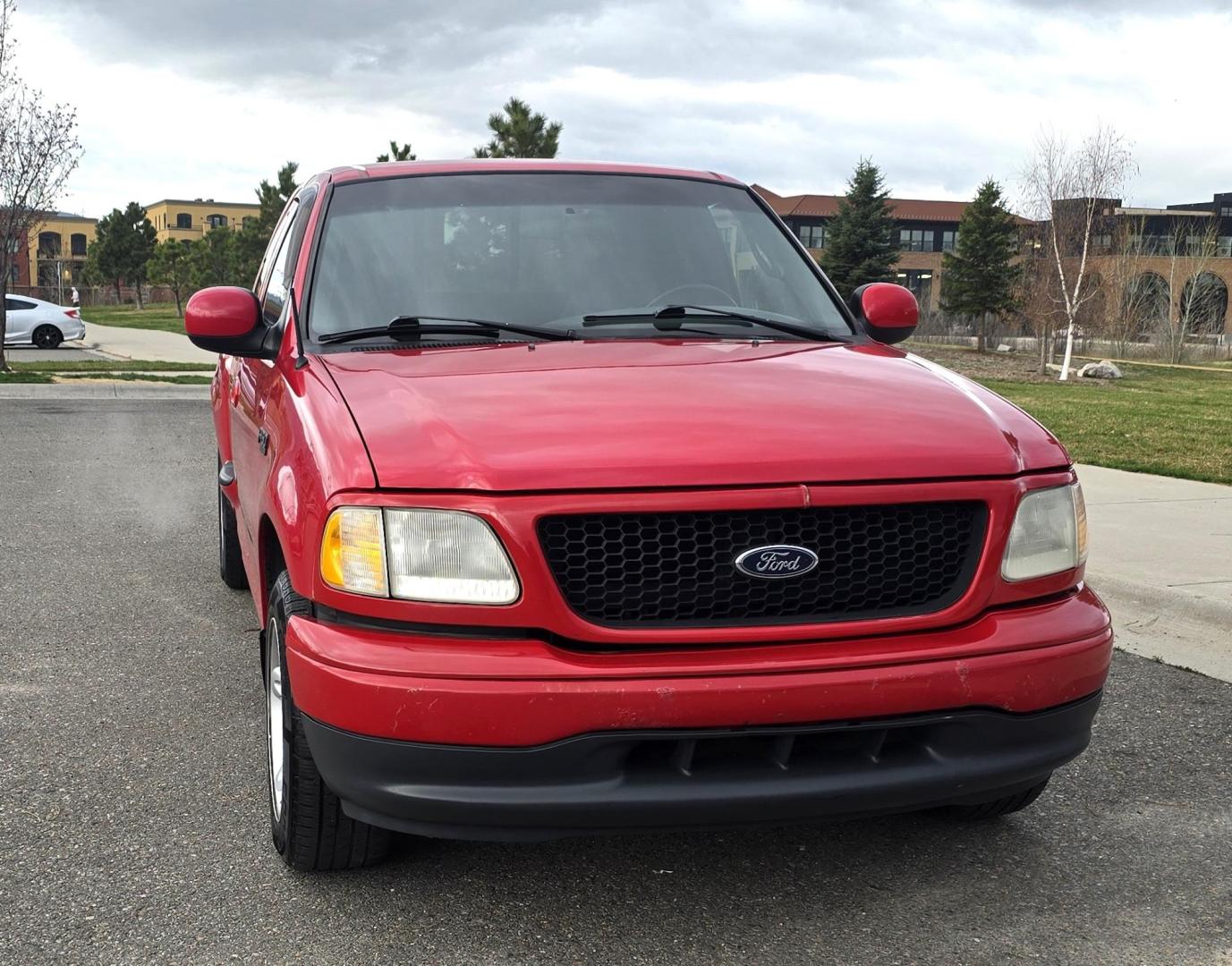 2000 Red /Black Ford F-150 XL SuperCab Flareside 2WD (1FTZX0721YK) with an 4.2L V6 OHV 12V engine, Automatic transmission, located at 450 N Russell, Missoula, MT, 59801, (406) 543-6600, 46.874496, -114.017433 - Cute F150 Stepside 2WD Pickup. Extended Cab. 4.2L V6 Engine. Automatic Transmission. Air. Cruise. Tilt. Power Windows and Locks. Aftermarket Bluetooth CD PLayer. Nice Hard Top on the Box. Excellent Cooper Tires. Because of the age, financing is not available through our lenders. - Photo#8