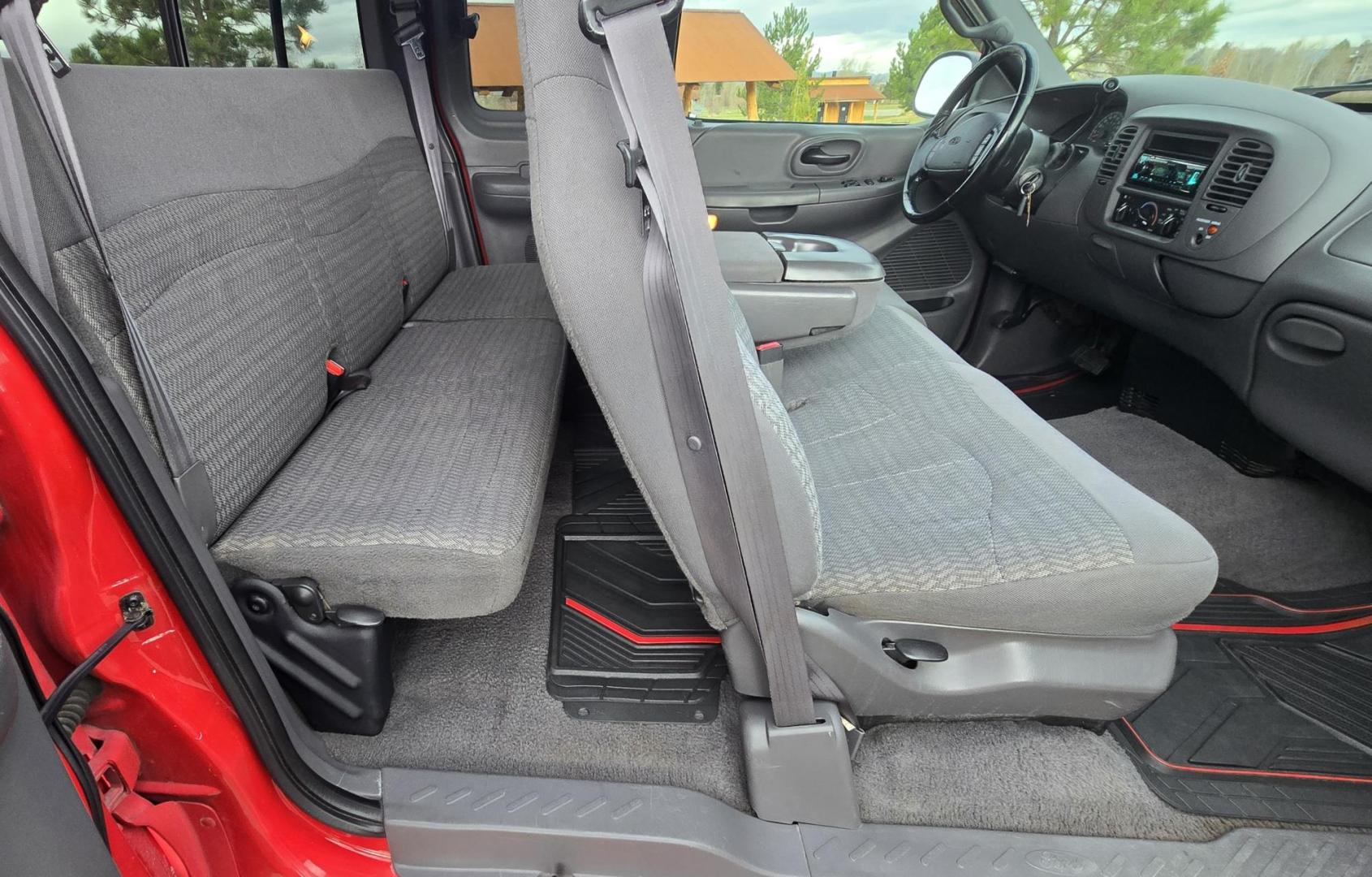 2000 Red /Black Ford F-150 XL SuperCab Flareside 2WD (1FTZX0721YK) with an 4.2L V6 OHV 12V engine, Automatic transmission, located at 450 N Russell, Missoula, MT, 59801, (406) 543-6600, 46.874496, -114.017433 - Cute F150 Stepside 2WD Pickup. Extended Cab. 4.2L V6 Engine. Automatic Transmission. Air. Cruise. Tilt. Power Windows and Locks. Aftermarket Bluetooth CD PLayer. Nice Hard Top on the Box. Excellent Cooper Tires. Because of the age, financing is not available through our lenders. - Photo#12