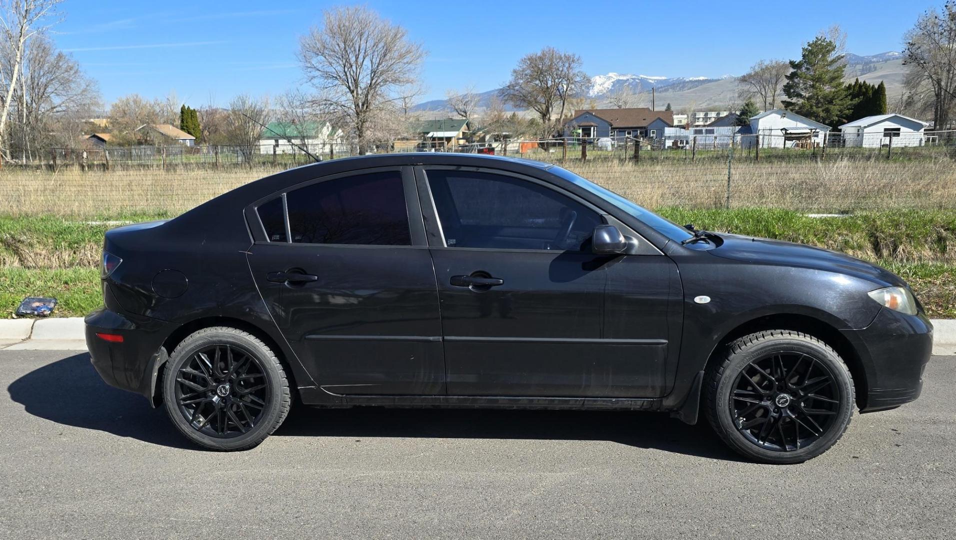 2008 Black /Black Mazda MAZDA3 i Sport 4-Door (JM1BK32FX81) with an 2.0L L4 DOHC 16V engine, Automatic transmission, located at 450 N Russell, Missoula, MT, 59801, (406) 543-6600, 46.874496, -114.017433 - Runs Great. Starts every time. 2.0L I4 Engine. Automatic Transmission. FWD. Air. Cruise. Tilt. Power Windows and Locks. AM FM XM CD Stereo with Bluetooth. Sunroof doe not open. Nice Wheels. - Photo#1