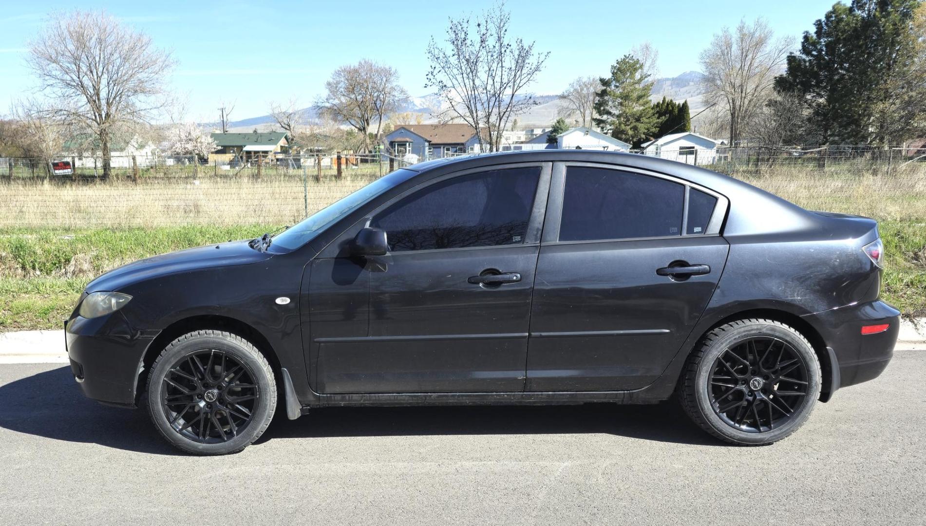 2008 Black /Black Mazda MAZDA3 i Sport 4-Door (JM1BK32FX81) with an 2.0L L4 DOHC 16V engine, Automatic transmission, located at 450 N Russell, Missoula, MT, 59801, (406) 543-6600, 46.874496, -114.017433 - Runs Great. Starts every time. 2.0L I4 Engine. Automatic Transmission. FWD. Air. Cruise. Tilt. Power Windows and Locks. AM FM XM CD Stereo with Bluetooth. Sunroof doe not open. Nice Wheels. - Photo#4