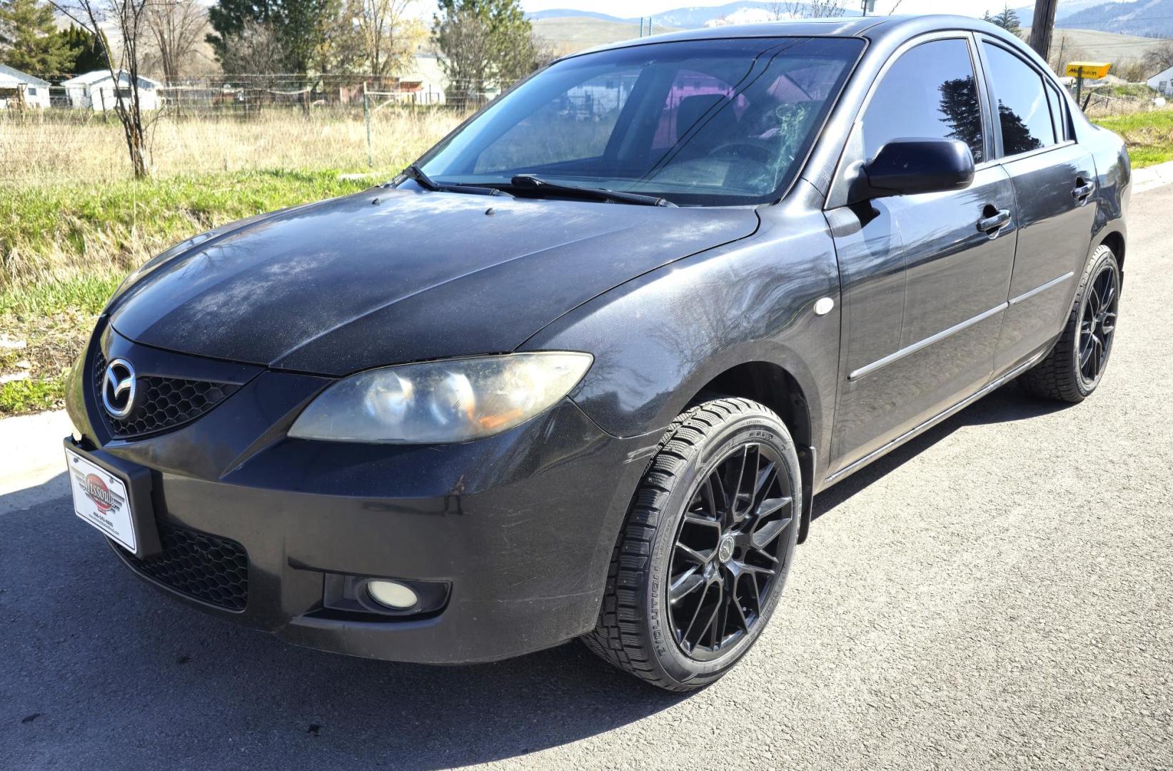 2008 Black /Black Mazda MAZDA3 i Sport 4-Door (JM1BK32FX81) with an 2.0L L4 DOHC 16V engine, Automatic transmission, located at 450 N Russell, Missoula, MT, 59801, (406) 543-6600, 46.874496, -114.017433 - Runs Great. Starts every time. 2.0L I4 Engine. Automatic Transmission. FWD. Air. Cruise. Tilt. Power Windows and Locks. AM FM XM CD Stereo with Bluetooth. Sunroof doe not open. Nice Wheels. - Photo#5