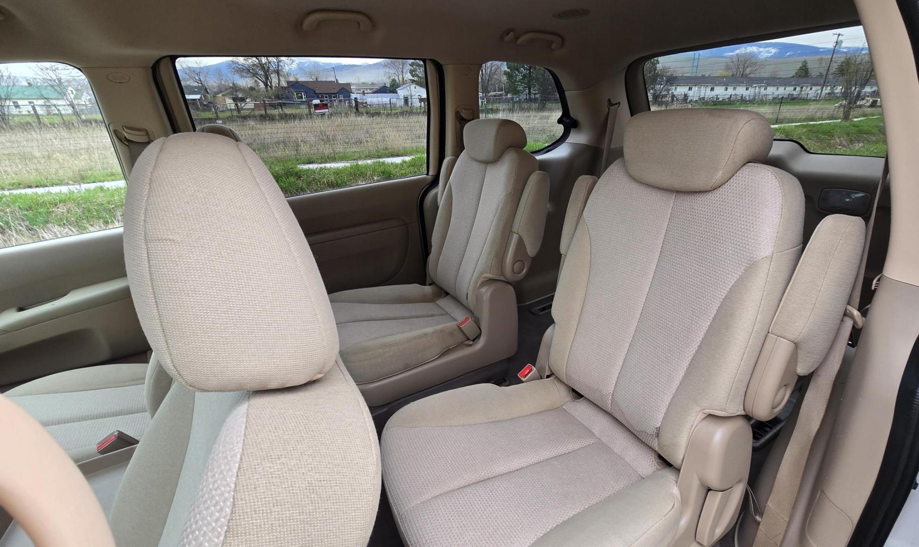 2010 White /Tan Kia Sedona Base SWB (KNDMG4C34A6) with an 3.8L V6 DOHC 24V engine, 5-Speed Automatic transmission, located at 450 N Russell, Missoula, MT, 59801, (406) 543-6600, 46.874496, -114.017433 - Clean 2 Owner FWD. 3.8L V6 Engine. Automatic Transmission. Rear Doors are Sliding for easy entrance. Front and Rear Climate Control. Air. Cruise. Tilt. Capable of third row seating but the rear seat is not there. AM FM CD Player. Clean Title and Carfax. - Photo#11