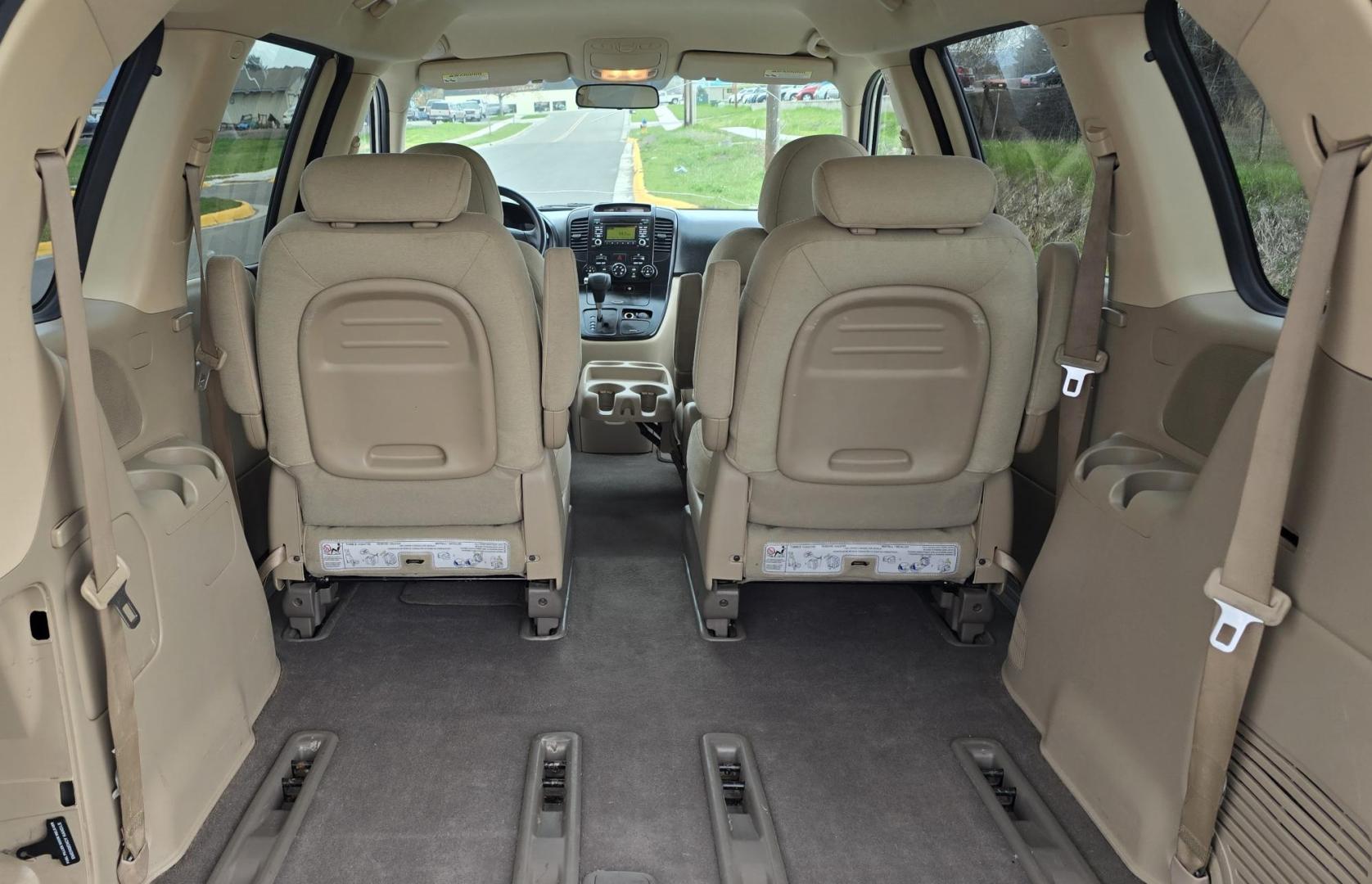 2010 White /Tan Kia Sedona Base SWB (KNDMG4C34A6) with an 3.8L V6 DOHC 24V engine, 5-Speed Automatic transmission, located at 450 N Russell, Missoula, MT, 59801, (406) 543-6600, 46.874496, -114.017433 - Clean 2 Owner FWD. 3.8L V6 Engine. Automatic Transmission. Rear Doors are Sliding for easy entrance. Front and Rear Climate Control. Air. Cruise. Tilt. Capable of third row seating but the rear seat is not there. AM FM CD Player. Clean Title and Carfax. - Photo#6