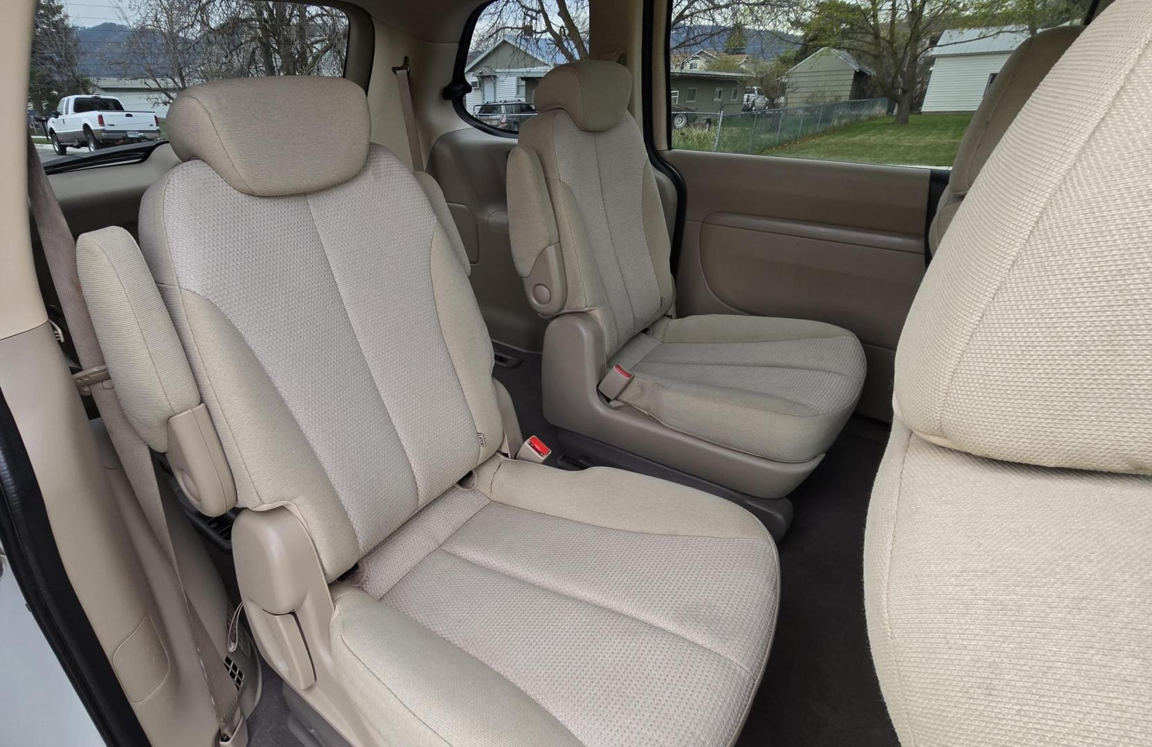 2010 White /Tan Kia Sedona Base SWB (KNDMG4C34A6) with an 3.8L V6 DOHC 24V engine, 5-Speed Automatic transmission, located at 450 N Russell, Missoula, MT, 59801, (406) 543-6600, 46.874496, -114.017433 - Clean 2 Owner FWD. 3.8L V6 Engine. Automatic Transmission. Rear Doors are Sliding for easy entrance. Front and Rear Climate Control. Air. Cruise. Tilt. Capable of third row seating but the rear seat is not there. AM FM CD Player. Clean Title and Carfax. - Photo#7