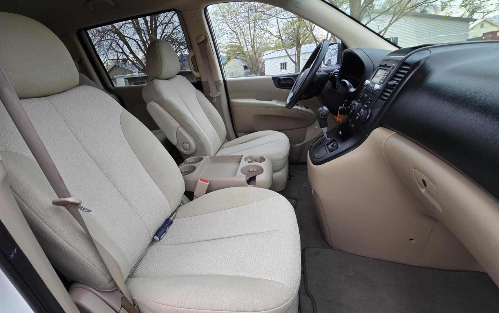 2010 White /Tan Kia Sedona Base SWB (KNDMG4C34A6) with an 3.8L V6 DOHC 24V engine, 5-Speed Automatic transmission, located at 450 N Russell, Missoula, MT, 59801, (406) 543-6600, 46.874496, -114.017433 - Clean 2 Owner FWD. 3.8L V6 Engine. Automatic Transmission. Rear Doors are Sliding for easy entrance. Front and Rear Climate Control. Air. Cruise. Tilt. Capable of third row seating but the rear seat is not there. AM FM CD Player. Clean Title and Carfax. - Photo#9