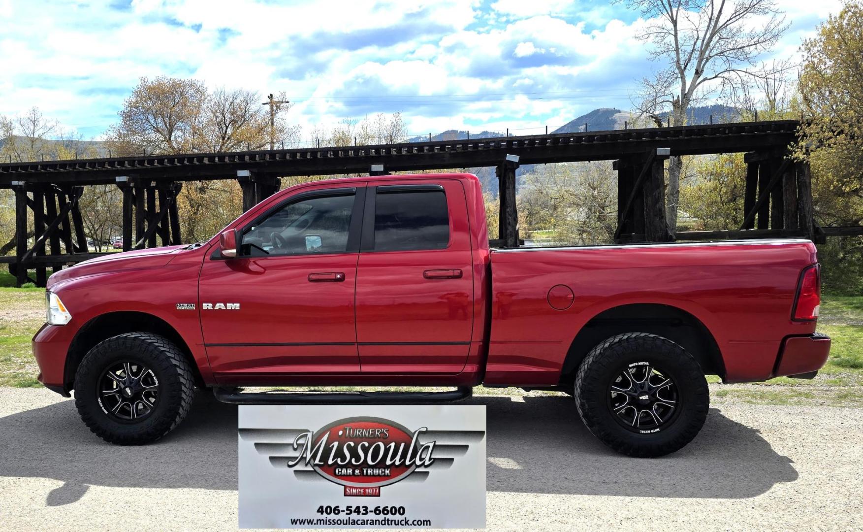 2010 Red /Gray Dodge Ram 1500 SLT Sport Quad Cab 4WD (1D7RV1GT1AS) with an 5.7L V8 OHV 16V engine, 5-Speed Automatic transmission, located at 450 N Russell, Missoula, MT, 59801, (406) 543-6600, 46.874496, -114.017433 - Beautiful Red 4WD Truck. 5.7L Hemi V8. Automatic Transmission. Air Cruise Tilt. Power Windows and Locks. Remote Start. Bluetooth Audio and Phone. Alpine Stereo System AM FM Sat CD Player with Harddrive. Navigation. Nice Aftermarket Wheels. Running Boards. Bed Liner. Has a couple small dents on passe - Photo#0