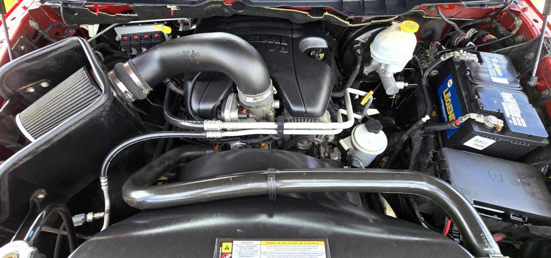 2010 Red /Gray Dodge Ram 1500 SLT Sport Quad Cab 4WD (1D7RV1GT1AS) with an 5.7L V8 OHV 16V engine, 5-Speed Automatic transmission, located at 450 N Russell, Missoula, MT, 59801, (406) 543-6600, 46.874496, -114.017433 - Beautiful Red 4WD Truck. 5.7L Hemi V8. Automatic Transmission. Air Cruise Tilt. Power Windows and Locks. Remote Start. Bluetooth Audio and Phone. Alpine Stereo System AM FM Sat CD Player with Harddrive. Navigation. Nice Aftermarket Wheels. Running Boards. Bed Liner. Has a couple small dents on passe - Photo#12