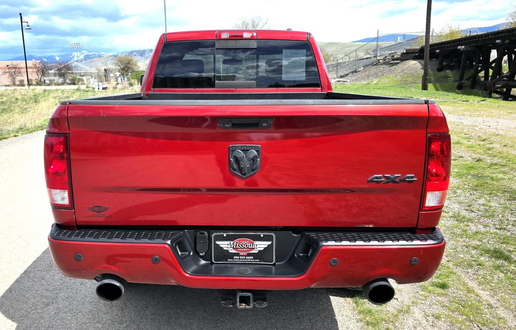 2010 Red /Gray Dodge Ram 1500 SLT Sport Quad Cab 4WD (1D7RV1GT1AS) with an 5.7L V8 OHV 16V engine, 5-Speed Automatic transmission, located at 450 N Russell, Missoula, MT, 59801, (406) 543-6600, 46.874496, -114.017433 - Beautiful Red 4WD Truck. 5.7L Hemi V8. Automatic Transmission. Air Cruise Tilt. Power Windows and Locks. Remote Start. Bluetooth Audio and Phone. Alpine Stereo System AM FM Sat CD Player with Harddrive. Navigation. Nice Aftermarket Wheels. Running Boards. Bed Liner. Has a couple small dents on passe - Photo#5