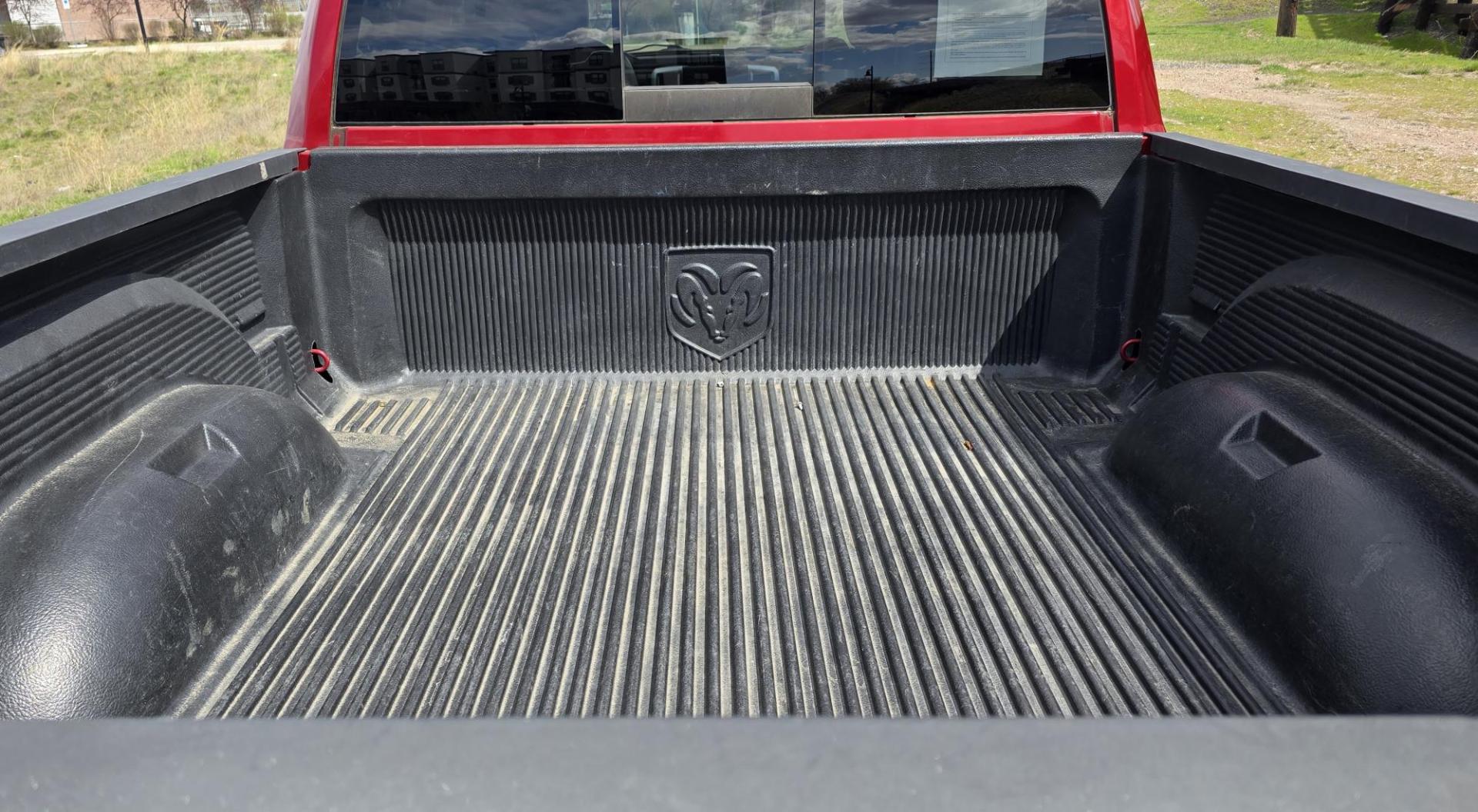 2010 Red /Gray Dodge Ram 1500 SLT Sport Quad Cab 4WD (1D7RV1GT1AS) with an 5.7L V8 OHV 16V engine, 5-Speed Automatic transmission, located at 450 N Russell, Missoula, MT, 59801, (406) 543-6600, 46.874496, -114.017433 - Beautiful Red 4WD Truck. 5.7L Hemi V8. Automatic Transmission. Air Cruise Tilt. Power Windows and Locks. Remote Start. Bluetooth Audio and Phone. Alpine Stereo System AM FM Sat CD Player with Harddrive. Navigation. Nice Aftermarket Wheels. Running Boards. Bed Liner. Has a couple small dents on passe - Photo#9