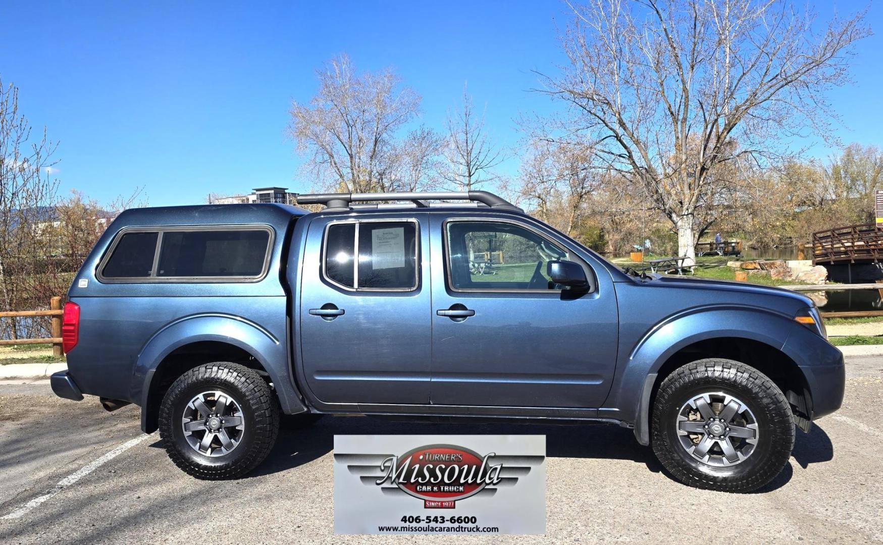 2014 Blue /Black Nissan Frontier Pro-4X Crew Cab 4WD (1N6AD0EV9EN) with an 4.0L V6 DOHC 24V engine, 5-Speed Automatic transmission, located at 450 N Russell, Missoula, MT, 59801, (406) 543-6600, 46.874496, -114.017433 - Hard to Find 4WD Truck in this size. 4.0L V6 Engine. Automatic Transmission. Matching Topper. Power Sunroof. Heated Power Seats. AM FM SAT Bluetooth. Backup Camera. Power Windows and Locks. Towing. Roof Rack. Clean Title and Carfax. - Photo#0
