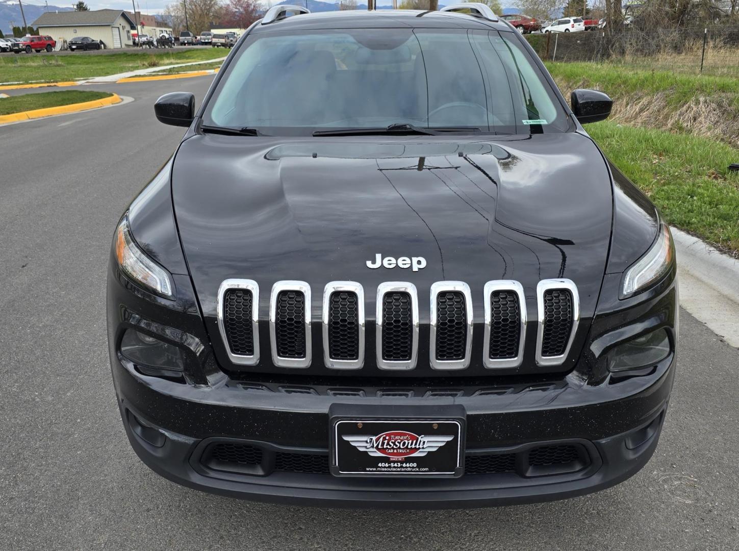 2016 Black /Black Jeep Cherokee Latitude 4WD (1C4PJMCS9GW) with an 3.2L V6 DOHC 24V engine, 9-Speed Automatic transmission, located at 450 N Russell, Missoula, MT, 59801, (406) 543-6600, 46.874496, -114.017433 - Black Jeep Cherokee Latitude 4WD. 3.2L V6 Engine. Air. Cruise. Tilt. Power Windows and Locks. Backup Camera. Bluetooth Audio and Phone. AM FM SAT. Passenger REar Door has a dent. - Photo#3