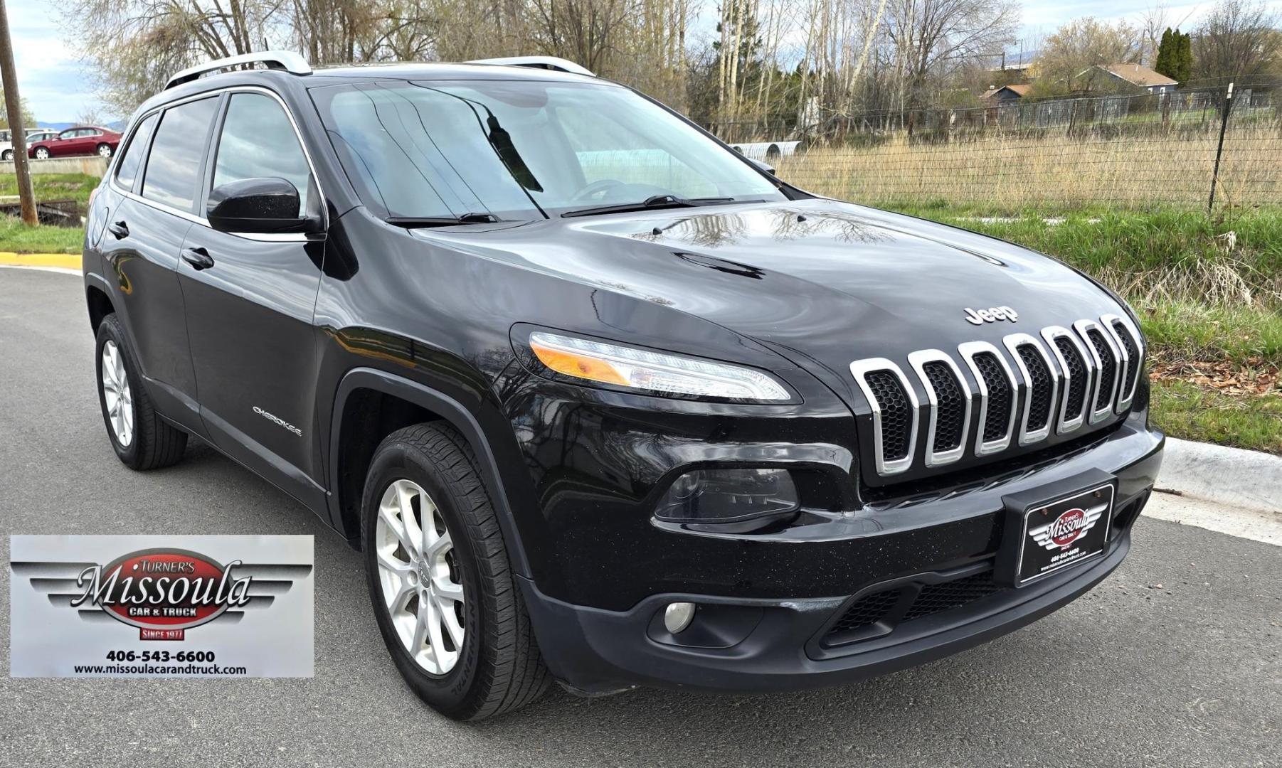 2016 Black /Black Jeep Cherokee Latitude 4WD (1C4PJMCS9GW) with an 3.2L V6 DOHC 24V engine, 9-Speed Automatic transmission, located at 450 N Russell, Missoula, MT, 59801, (406) 543-6600, 46.874496, -114.017433 - Black Jeep Cherokee Latitude 4WD. 3.2L V6 Engine. Air. Cruise. Tilt. Power Windows and Locks. Backup Camera. Bluetooth Audio and Phone. AM FM SAT. Passenger REar Door has a dent. - Photo#2