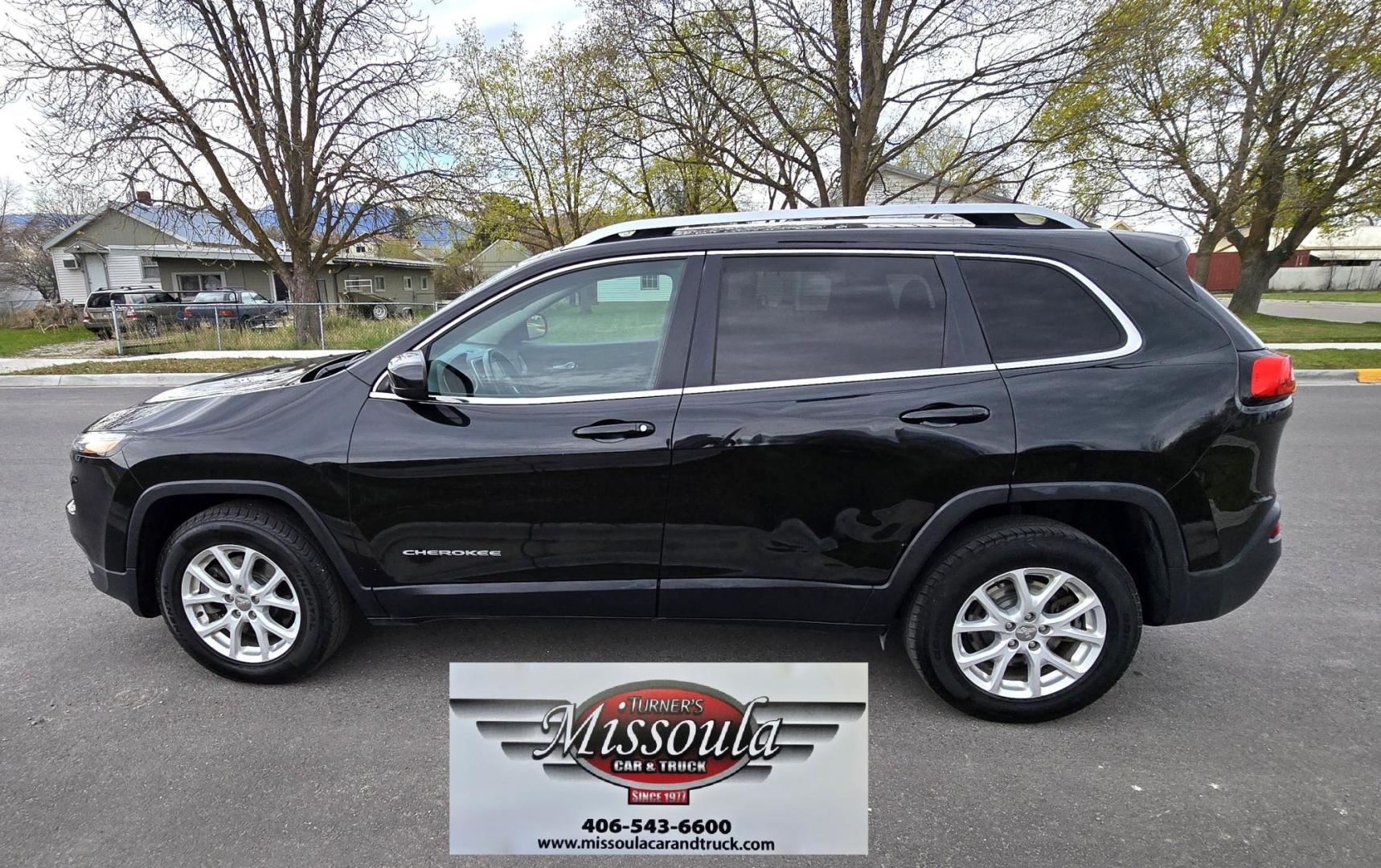 2016 Black /Black Jeep Cherokee Latitude 4WD (1C4PJMCS9GW) with an 3.2L V6 DOHC 24V engine, 9-Speed Automatic transmission, located at 450 N Russell, Missoula, MT, 59801, (406) 543-6600, 46.874496, -114.017433 - Black Jeep Cherokee Latitude 4WD. 3.2L V6 Engine. Air. Cruise. Tilt. Power Windows and Locks. Backup Camera. Bluetooth Audio and Phone. AM FM SAT. Passenger REar Door has a dent. - Photo#1
