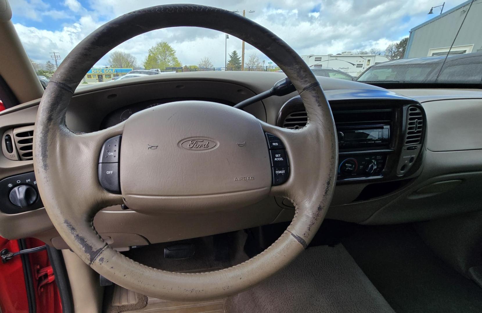 2000 Red /Tan Ford F-150 Lariat SuperCab 4WD (1FTRX18L1YN) with an 5.4L V8 SOHC 16V engine, 4-Speed Automatic Overdrive transmission, located at 450 N Russell, Missoula, MT, 59801, (406) 543-6600, 46.874496, -114.017433 - Strong Running 4WD Truck. 5.4L V8 Engine. Automatic Transmission. 4 Doors. Air. Cruise. Tilt. Power Windows and Locks. Aftermarket AM FM CD Player. Bedliner. Running Boards. Because of the age, financing is not available through our lenders. - Photo#11