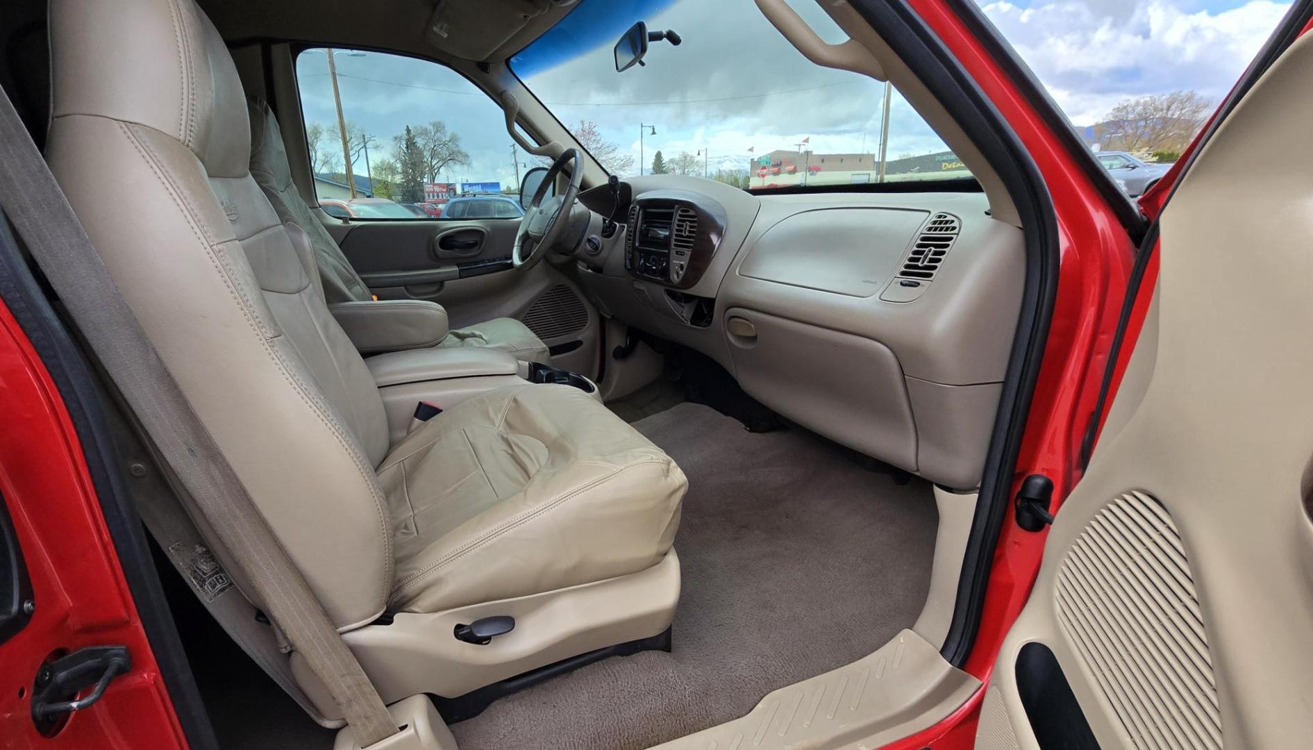 2000 Red /Tan Ford F-150 Lariat SuperCab 4WD (1FTRX18L1YN) with an 5.4L V8 SOHC 16V engine, 4-Speed Automatic Overdrive transmission, located at 450 N Russell, Missoula, MT, 59801, (406) 543-6600, 46.874496, -114.017433 - Strong Running 4WD Truck. 5.4L V8 Engine. Automatic Transmission. 4 Doors. Air. Cruise. Tilt. Power Windows and Locks. Aftermarket AM FM CD Player. Bedliner. Running Boards. Because of the age, financing is not available through our lenders. - Photo#12