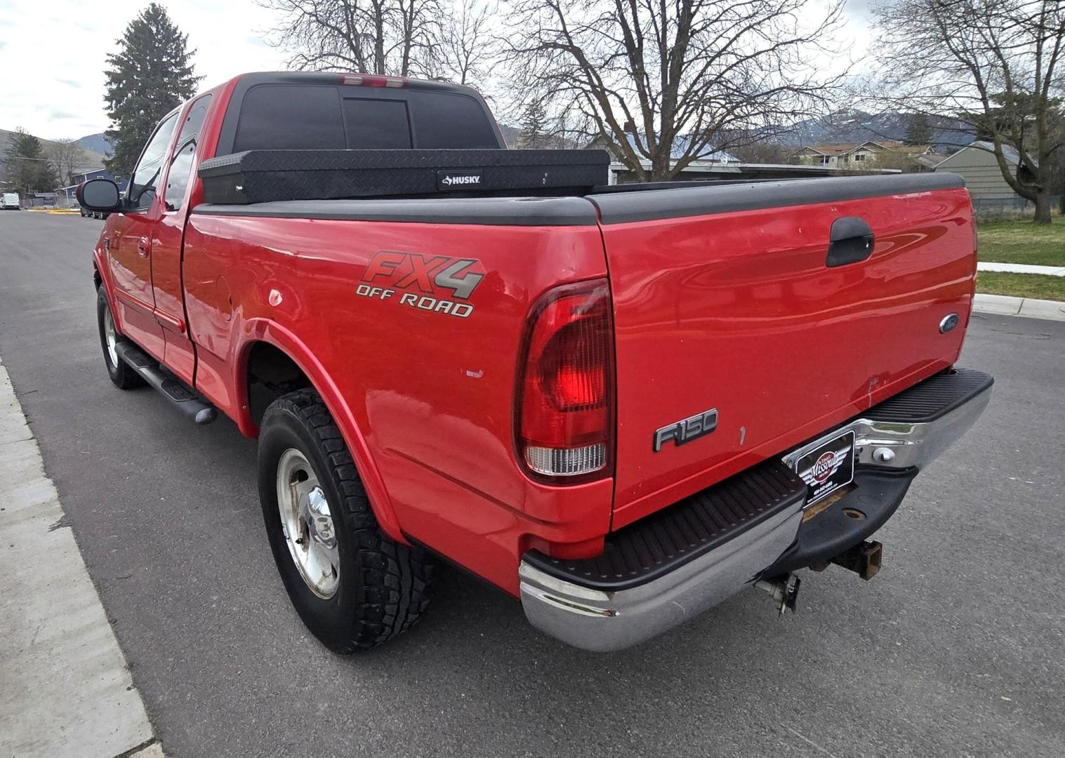 2000 Red /Tan Ford F-150 Lariat SuperCab 4WD (1FTRX18L1YN) with an 5.4L V8 SOHC 16V engine, 4-Speed Automatic Overdrive transmission, located at 450 N Russell, Missoula, MT, 59801, (406) 543-6600, 46.874496, -114.017433 - Strong Running 4WD Truck. 5.4L V8 Engine. Automatic Transmission. 4 Doors. Air. Cruise. Tilt. Power Windows and Locks. Aftermarket AM FM CD Player. Bedliner. Running Boards. Because of the age, financing is not available through our lenders. - Photo#5