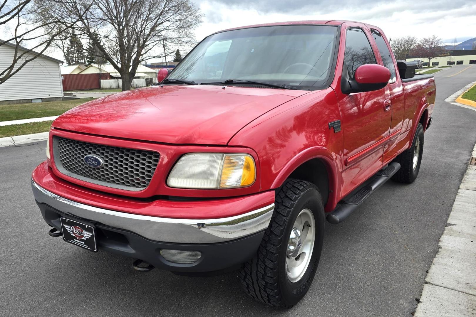 2000 Red /Tan Ford F-150 Lariat SuperCab 4WD (1FTRX18L1YN) with an 5.4L V8 SOHC 16V engine, 4-Speed Automatic Overdrive transmission, located at 450 N Russell, Missoula, MT, 59801, (406) 543-6600, 46.874496, -114.017433 - Strong Running 4WD Truck. 5.4L V8 Engine. Automatic Transmission. 4 Doors. Air. Cruise. Tilt. Power Windows and Locks. Aftermarket AM FM CD Player. Bedliner. Running Boards. Because of the age, financing is not available through our lenders. - Photo#4