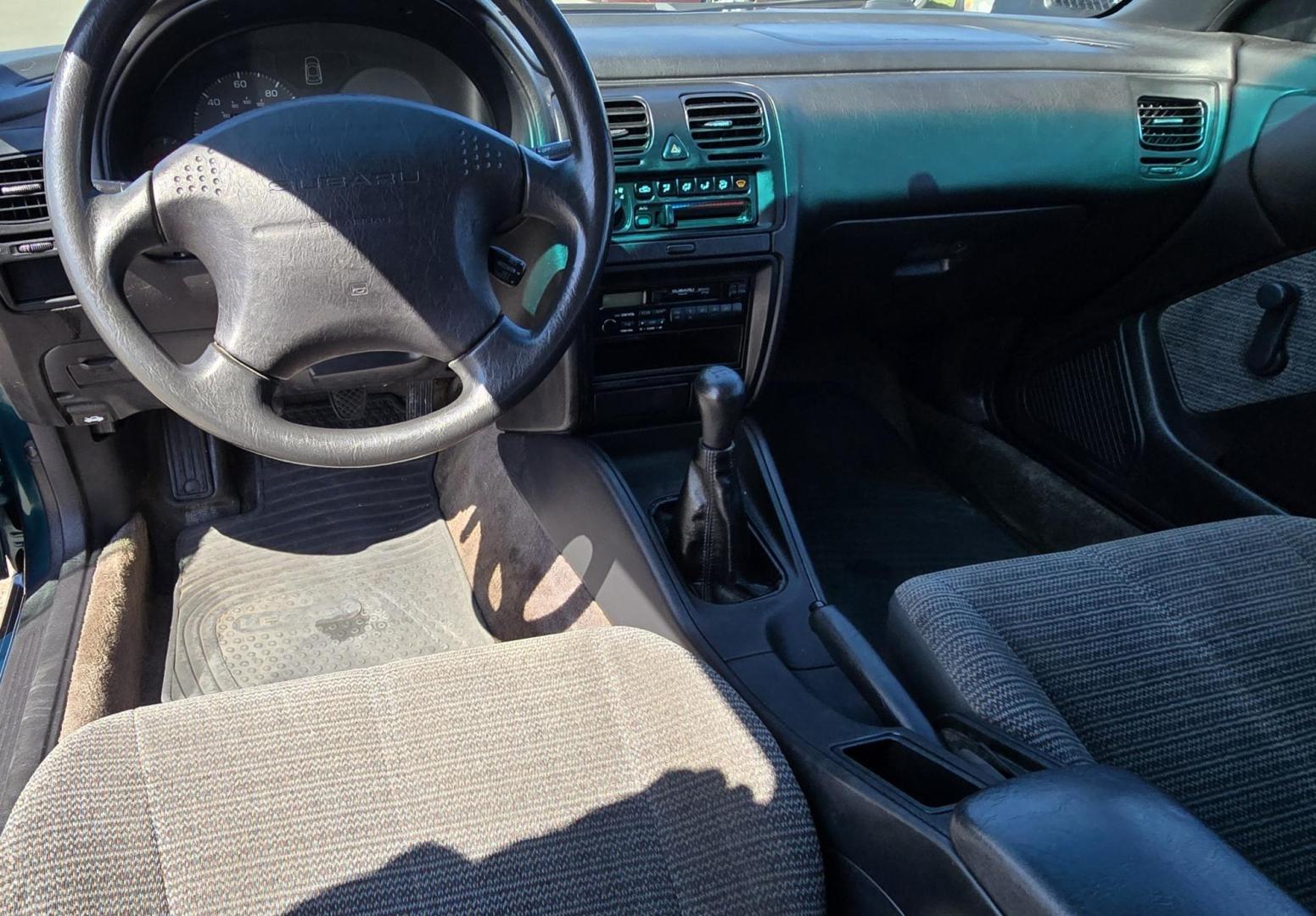 1998 Green /Gray Subaru Legacy Wagon Brighton AWD (4S3BK4259W6) with an 2.2L H4 SOHC 16V engine, 5-Speed Manual Overdrive transmission, located at 450 N Russell, Missoula, MT, 59801, (406) 543-6600, 46.874496, -114.017433 - Hard to find Low Mile AWD Subaru Brighton. Only 106K Miles. 2.2L H4 Engine. 5 Speed Manual Transmission. Air. Cruise. Tilt. AM FM Cassette. Has a little rust but overall good condition. Clean Carfax and Title. Because of the age of this vehicle. Financing is ntt available through our lenders. - Photo#7