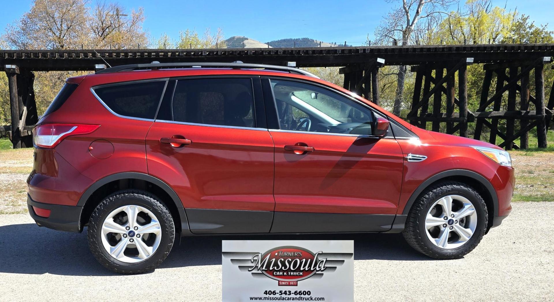2014 Orange /Gray Ford Escape SE 4WD (1FMCU9G94EU) with an 2.0L L4 DOHC 16V engine, 6-Speed Automatic transmission, located at 450 N Russell, Missoula, MT, 59801, (406) 543-6600, 46.874496, -114.017433 - Beautiful Ford Escape. AWD. Official Color is Sunset Metallic. 2.0L I4 Engine. Automatic Transmission. Air. Cruise. Tilt. Bluetooth Audio and Phone. Backup Camera. Power Windows and Locks. AM FM SAT CD Player. Roof Rack. Towing. - Photo#1