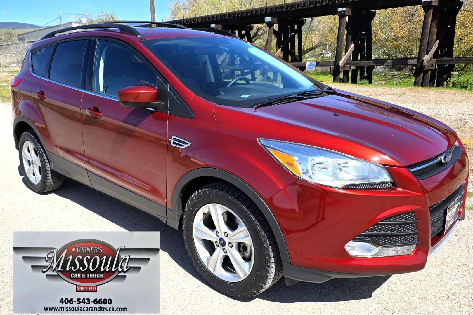 2014 Orange /Gray Ford Escape SE 4WD (1FMCU9G94EU) with an 2.0L L4 DOHC 16V engine, 6-Speed Automatic transmission, located at 450 N Russell, Missoula, MT, 59801, (406) 543-6600, 46.874496, -114.017433 - Beautiful Ford Escape. AWD. Official Color is Sunset Metallic. 2.0L I4 Engine. Automatic Transmission. Air. Cruise. Tilt. Bluetooth Audio and Phone. Backup Camera. Power Windows and Locks. AM FM SAT CD Player. Roof Rack. Towing. - Photo#3